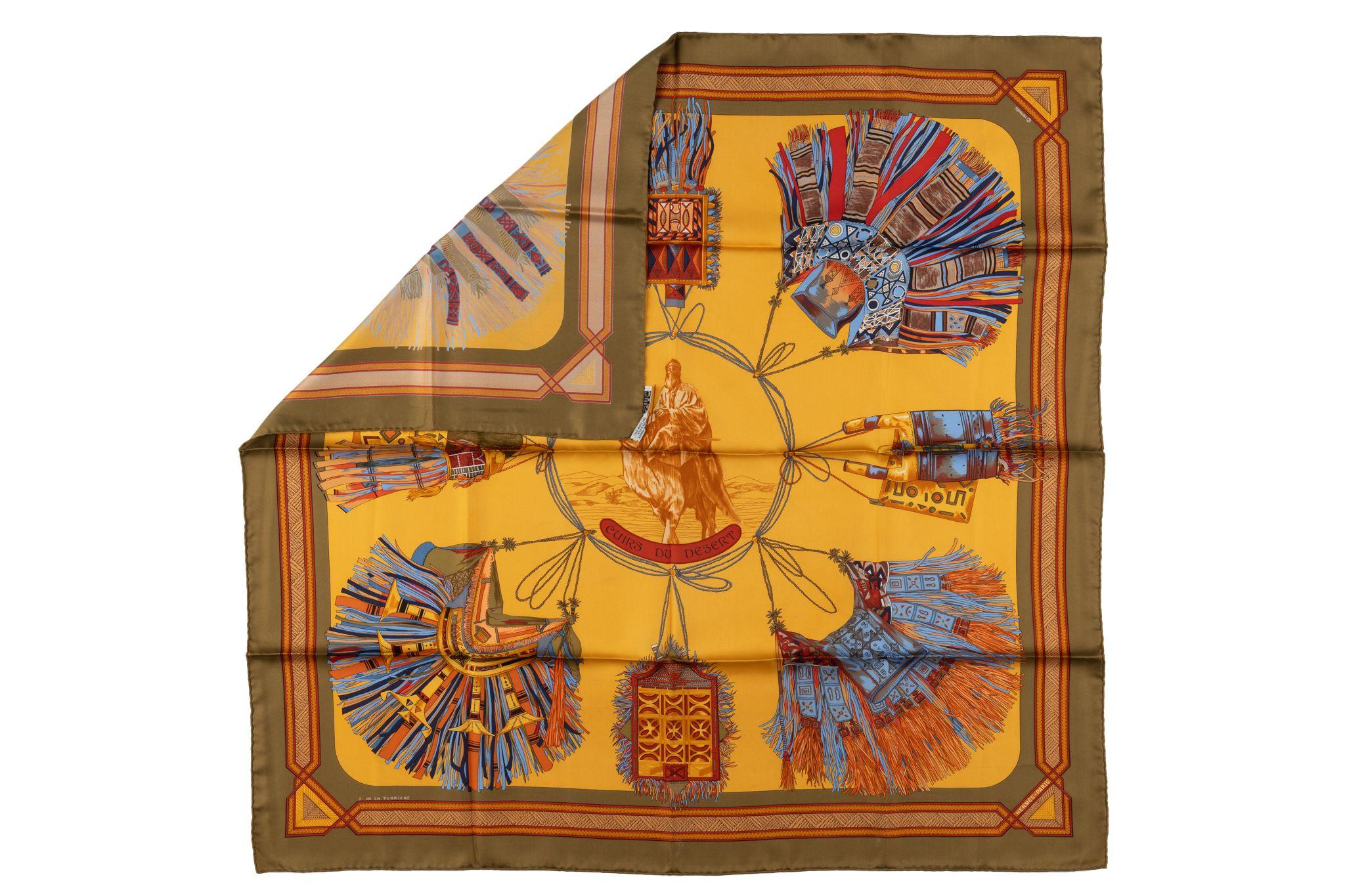 This authentic Hermès Cuirs Du Desert scarf by Françoise De La Perriere is a gorgeous multi-color gold-toned piece. The scarf is a 100% silk scarf with hand-rolled edges. Comes with no box.
