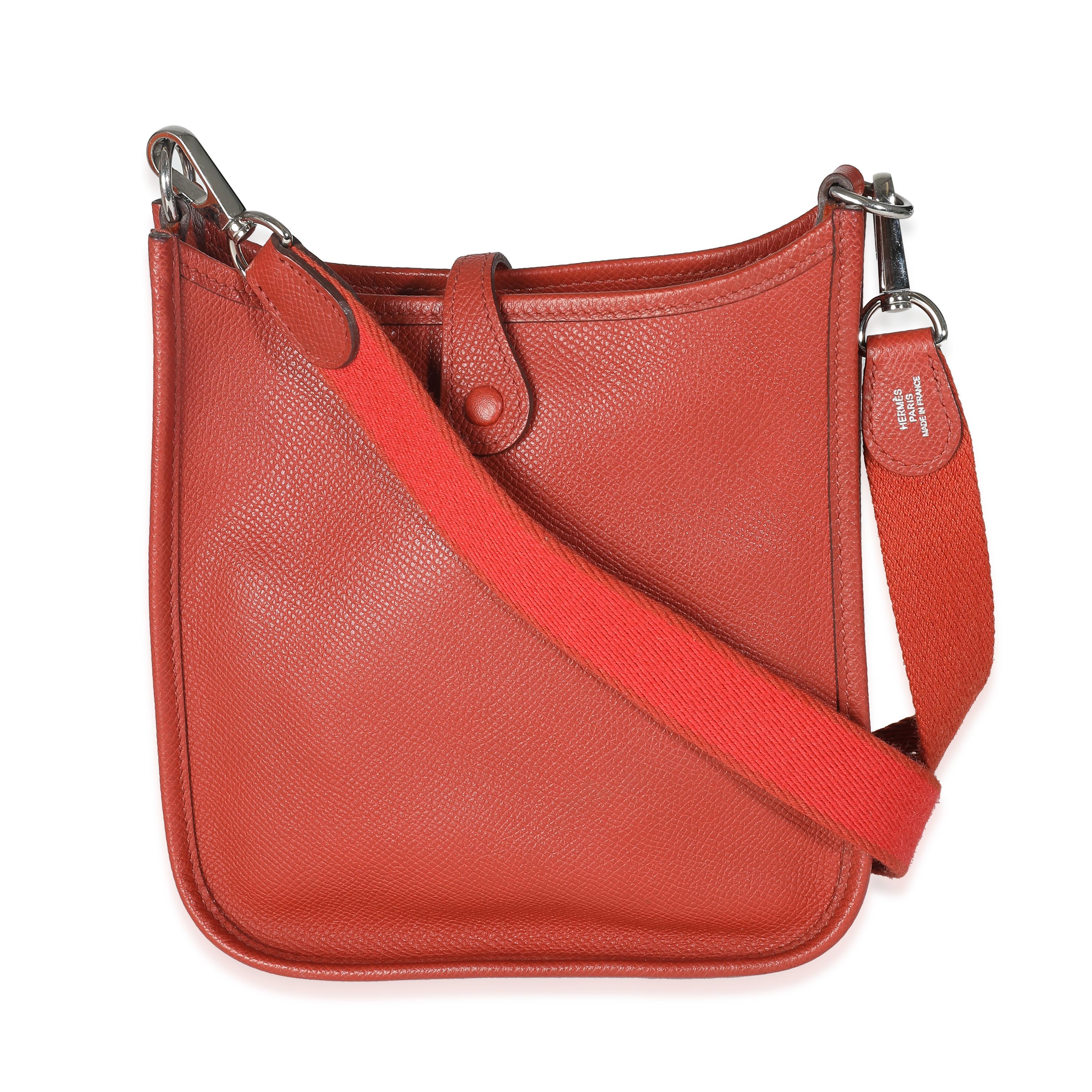 Listing Title: Hermès Cuivre Epsom Mini Evelyne TPM PHW
SKU: 141183
Condition: Pre-owned 
Condition Description: Designed in 1978 by Evelyne Bertrand, the Evelyne shoulder bag from Hermès has a distinctive aesthetic thanks to a perforated 'H' logo