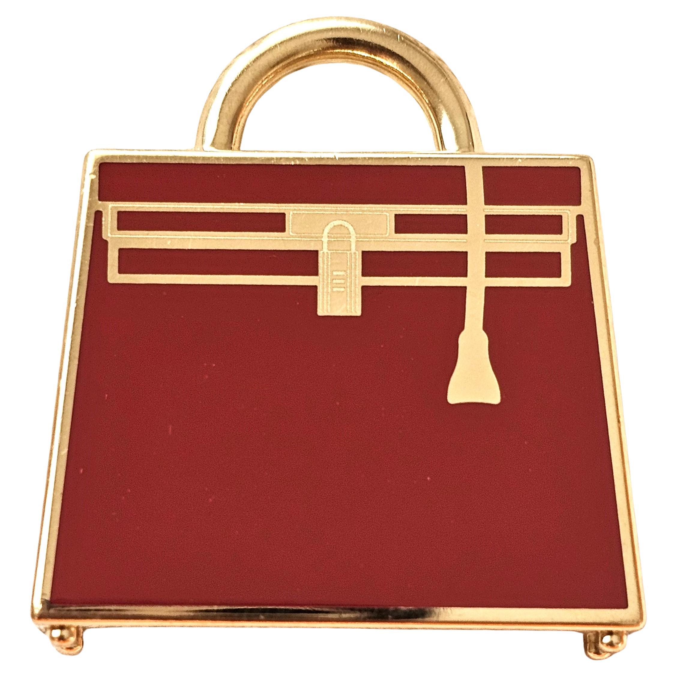 Hermès Curiosite Permabrass Kelly Bag Ciondolo o Charm Laque