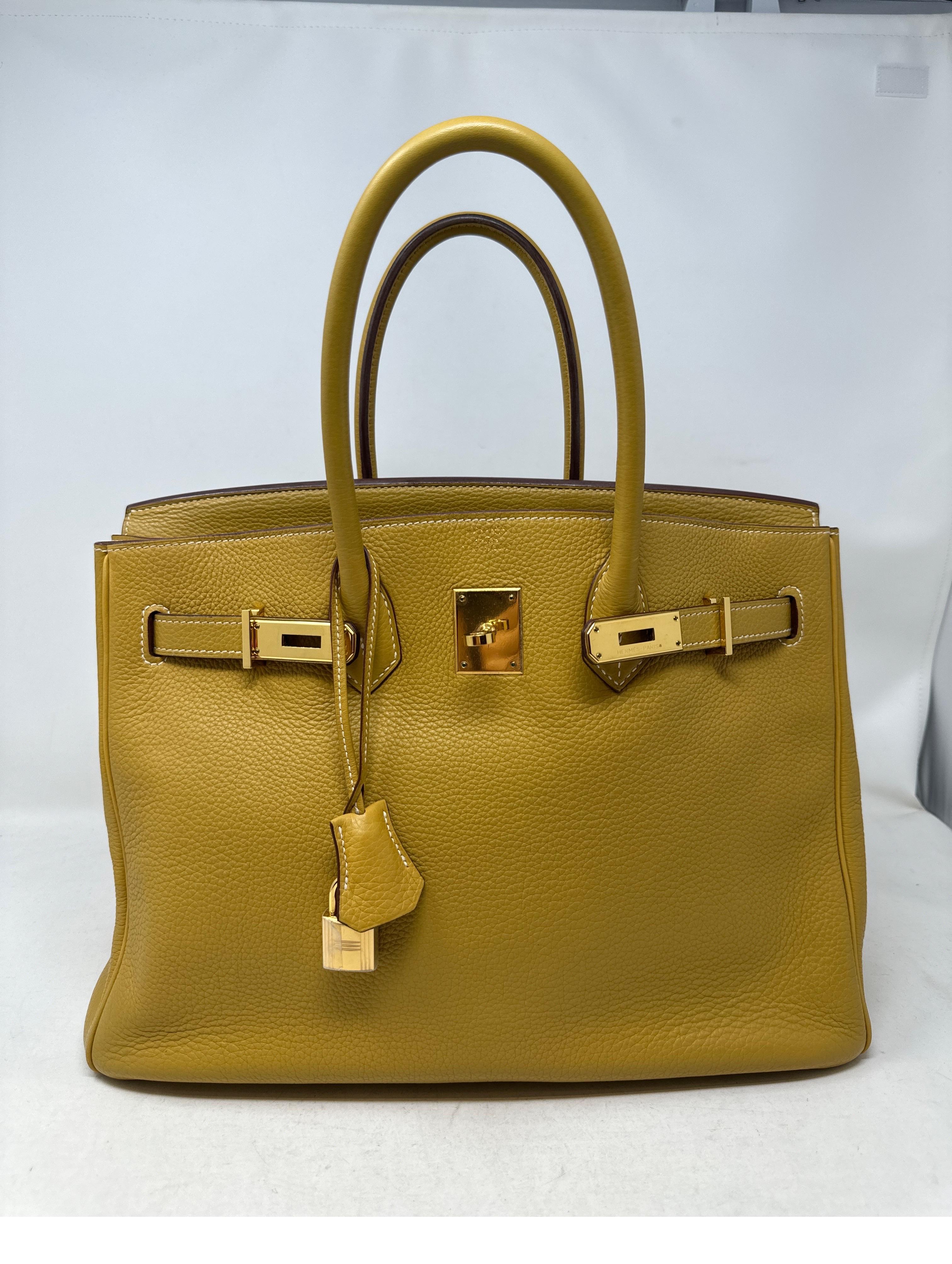 Hermes Curry Yellow Birkin Bag. Very good condition. Gold hardware. Clemence leather. Interior clean. Light yellow neutral color. Includes clochette, lock, keys, and dust bag. Guaranteed authentic. 