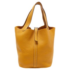 Hermès Curry Taurillon Clemence Leder Picotin Lock 22 Tasche