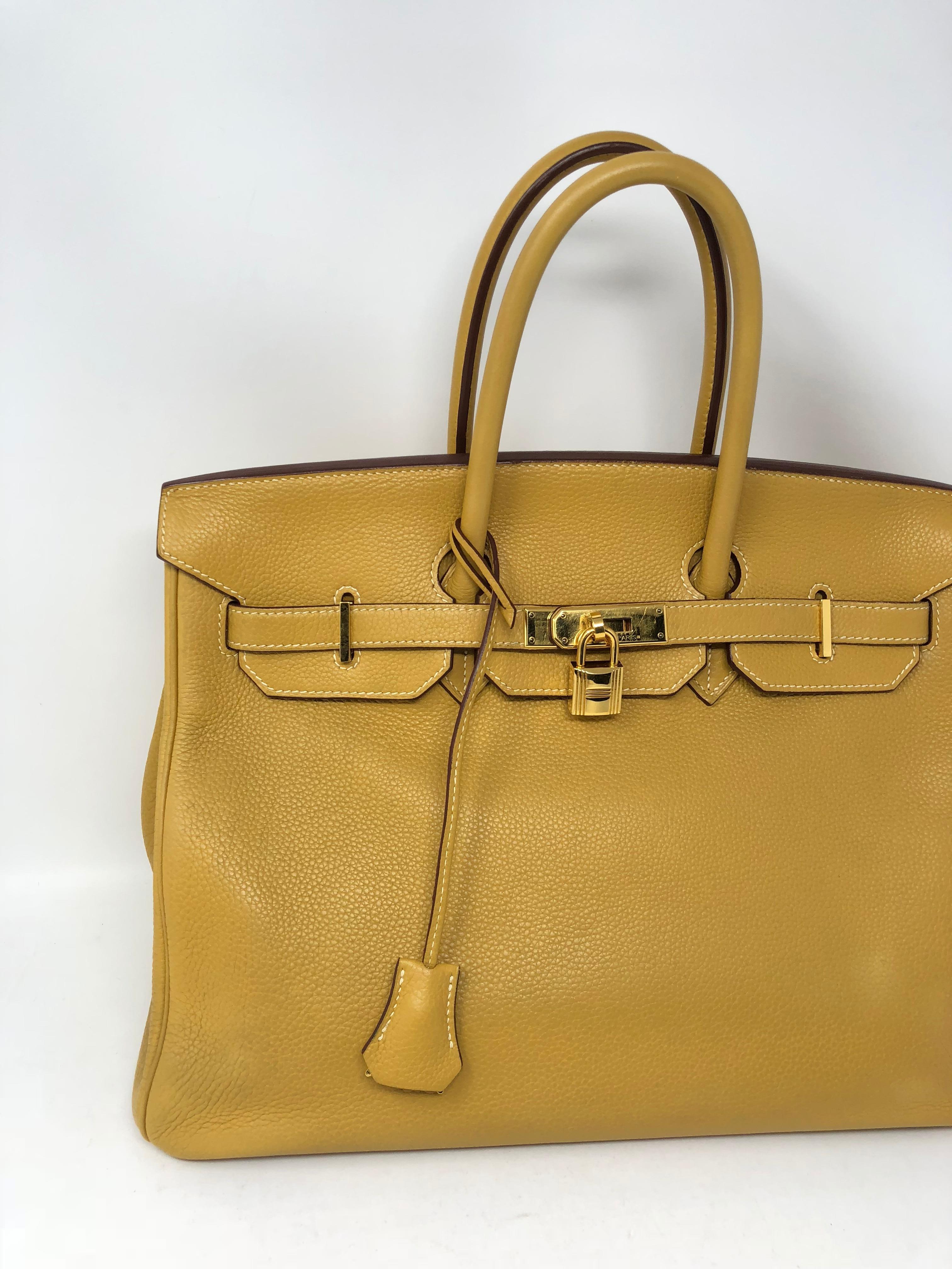 Hermes Birkin 35 in Curry Yellow with gold hardware. Neutral color in good condition. Minimal wear and nice togo leather. Stamped L square from 2008. 