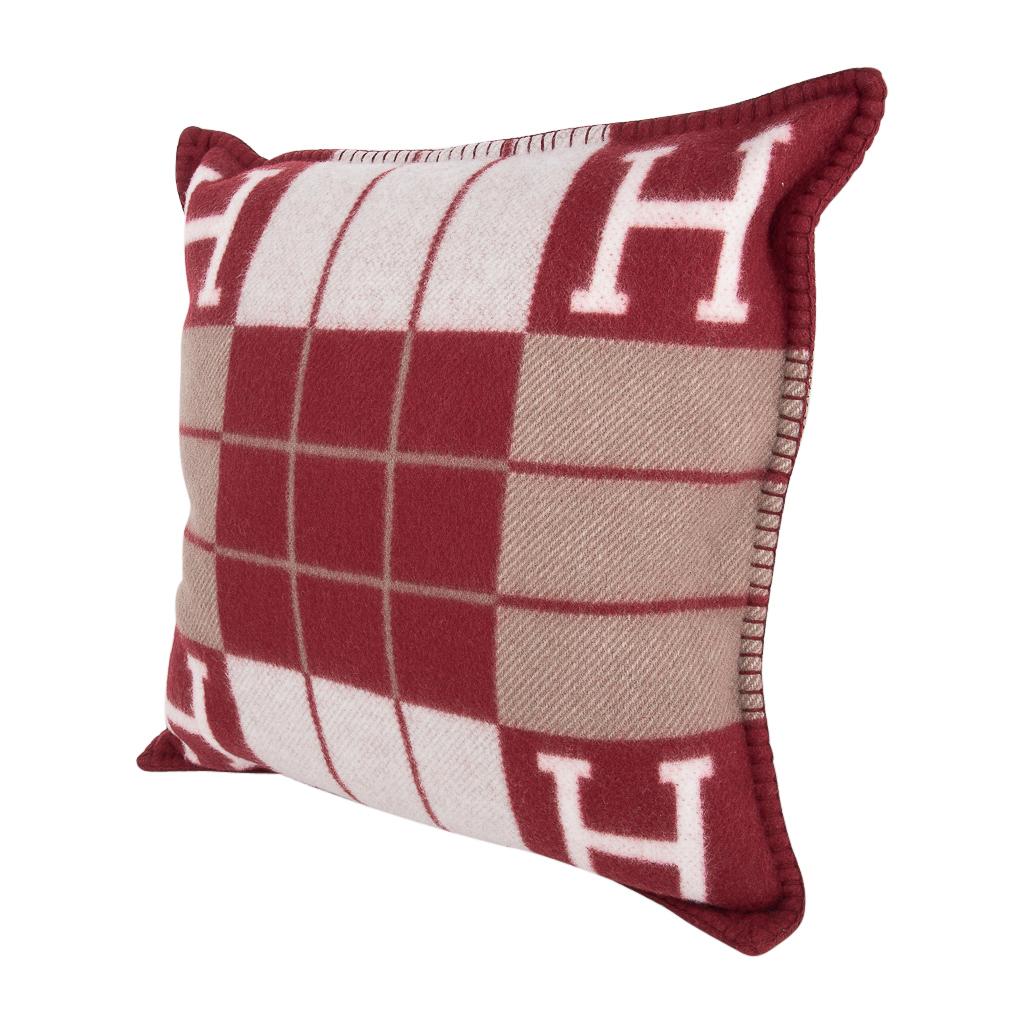 Mightychic offers a guaranteed authentic Hermes classic Small Model Avalon III signature H pillow features Rouge H and Ecru.
The removable cover is created from 90% Wool and 10% cashmere and has whip stitch edges.
New or Pristine Store Fresh