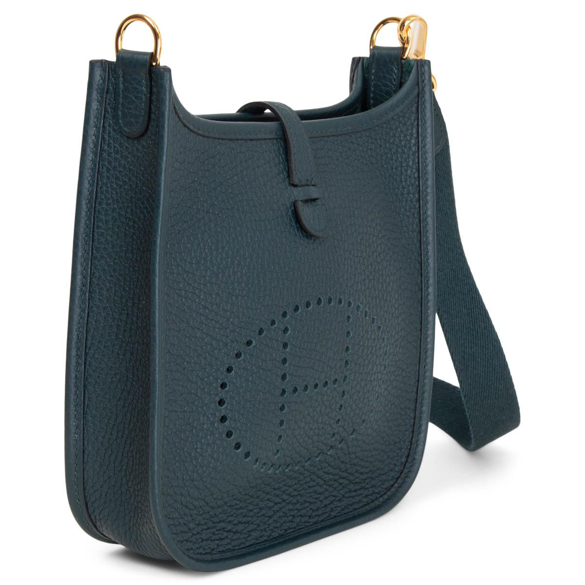 100% authentic Hermès Evelyne 16 Amazone crossbody bag in Cypress (pine green) Taurillon Clemence leather with sangle wool strap in petrol blue, perforated leather 