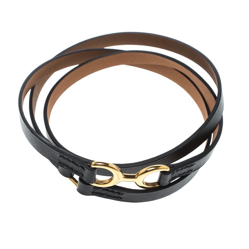 Characterised by the gold-tone Horsebit-inspired hardware accent, this Dandy Pavane bracelet from Hermes is designed from leather to wrap around your wrist three times, adding a touch of bold style to your casual look. It is secured by square hinged