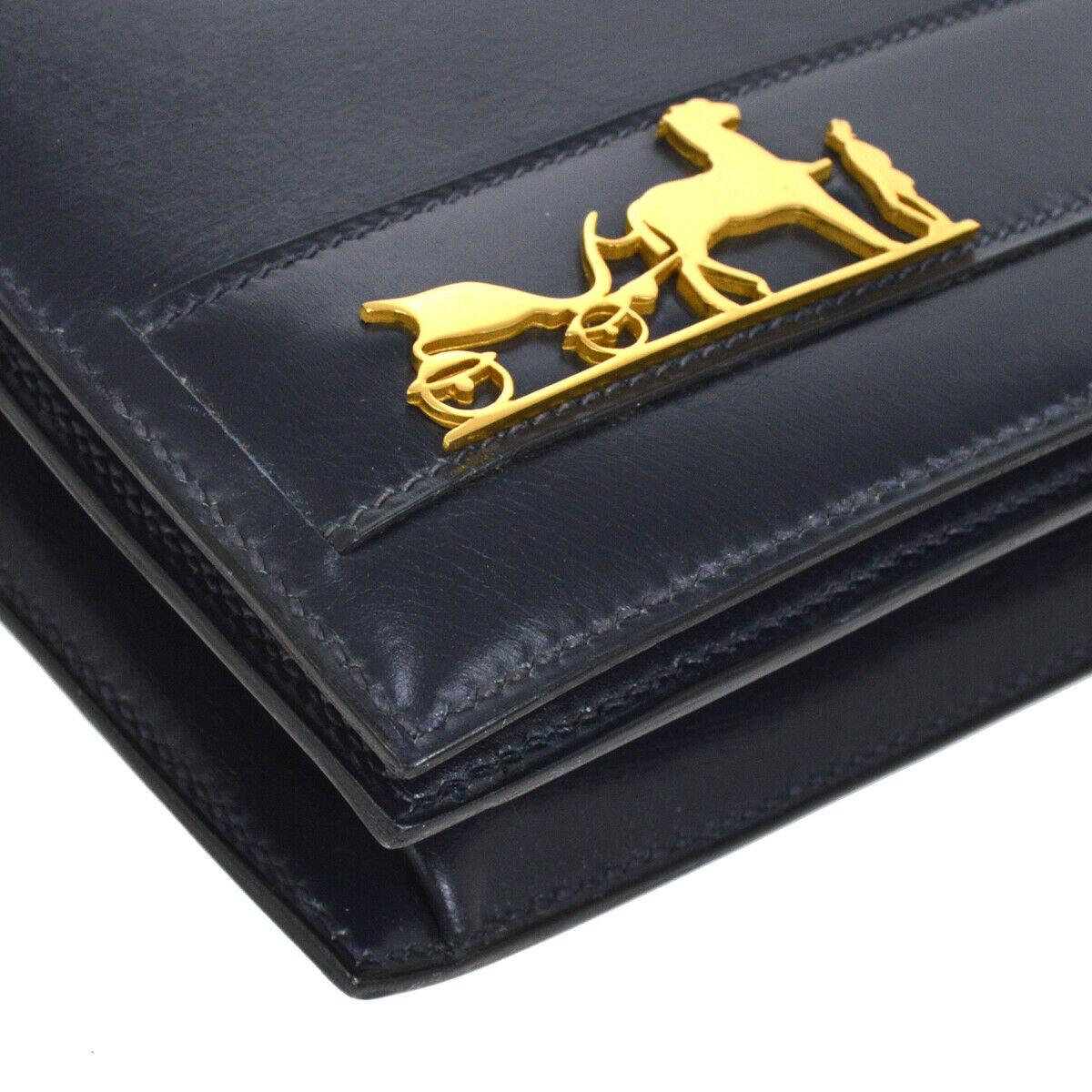 Hermes Dark Blue Navy Leather Horse Gold Emblem Evening Clutch Top Handle Flap Bag

Leather
Gold tone hardware
Leather lining
Made in France
Date code present
Handle drop 1.5
