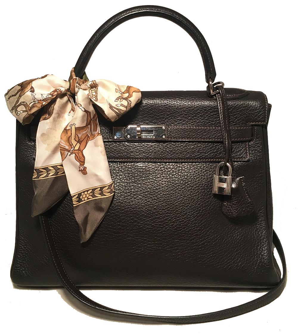 Hermes dark brown clemence leather 32cm kelly bag in excellent condition. Dark brown clemence 
leather exterior trimmed with silver palladium hardware. Front signature kelly style double strap twist closure opens to a brown leather lined interior