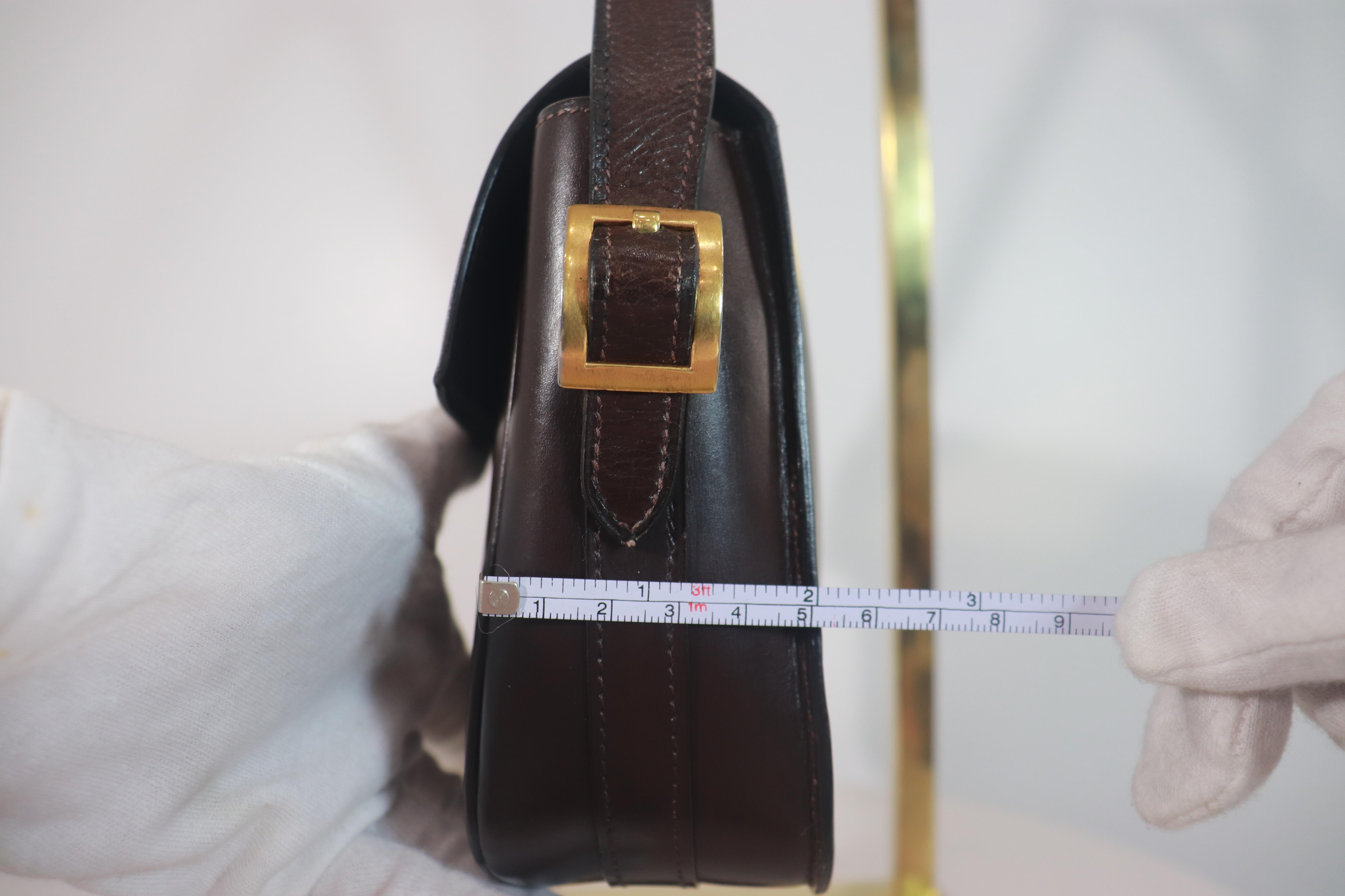 Black HERMÈS Dark Brown Leather Crossbody Bag with Gold Buckle and Adjustable Strap For Sale