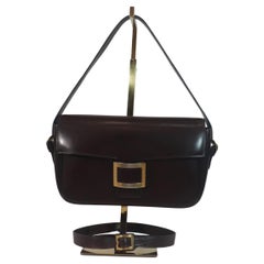 Vintage HERMÈS Dark Brown Leather Crossbody Bag with Gold Buckle and Adjustable Strap