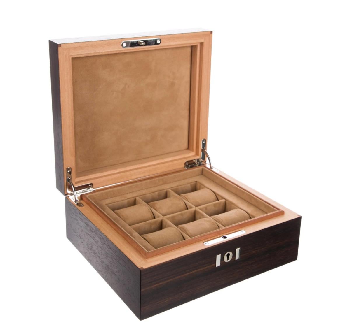 Wood 
Suede interior
Made in France
Lock and key closure
Features 6 watch rolls
Lock and key closure  
Measurements 9.5