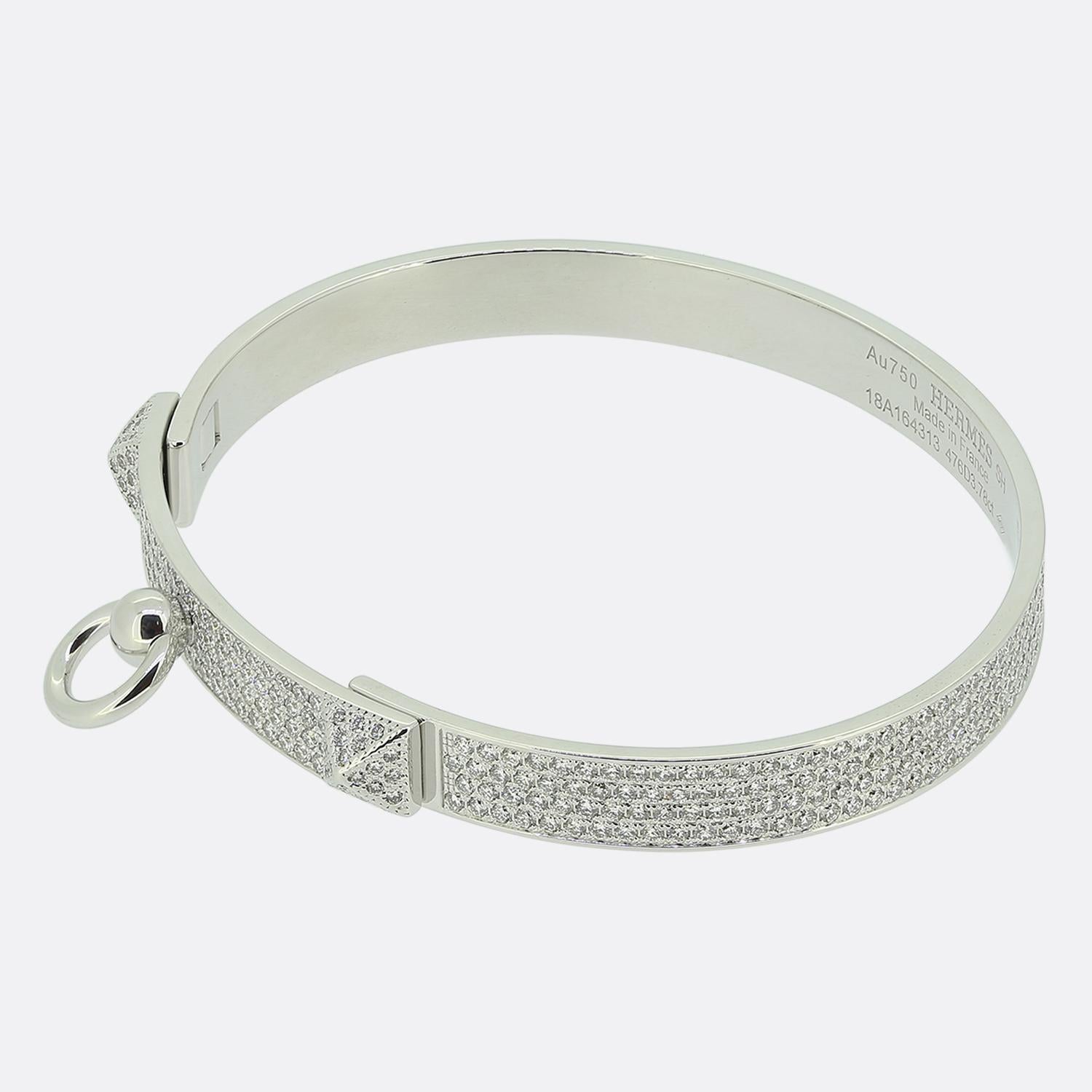 Here we have a iconic piece from the world renowned luxury fashion designer, Hermès. An instantly recognisable 18ct white gold bracelet with a high polished finish plays host to 476 scintillating round brilliant cut diamonds stacked across four rows