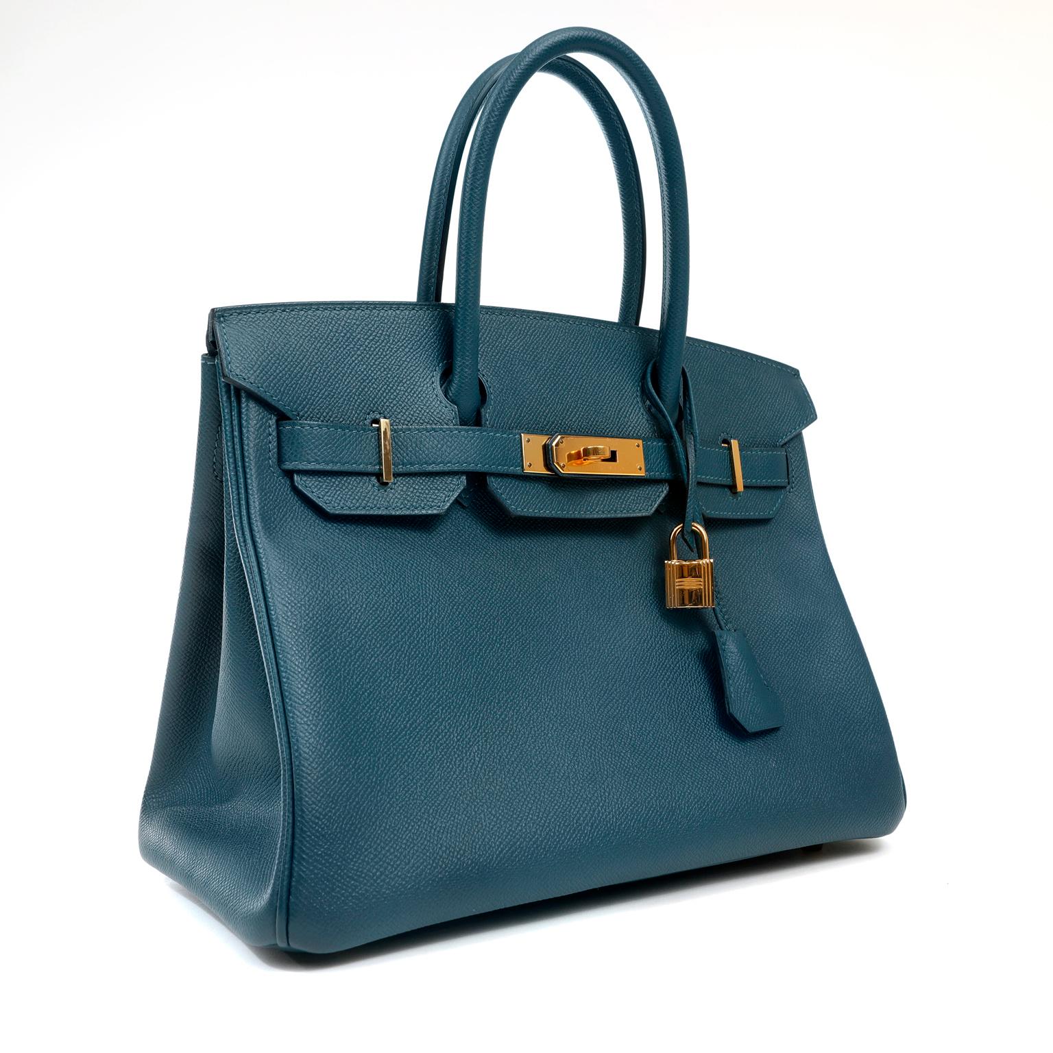 This authentic Hermès Deep Blue Epsom 30 cm Birkin is in excellent plus condition.  Considered the ultimate luxury item, the Hermès Birkin is stitched by hand and coveted worldwide.   
 Epsom leather is textured and scratch resistant with a light