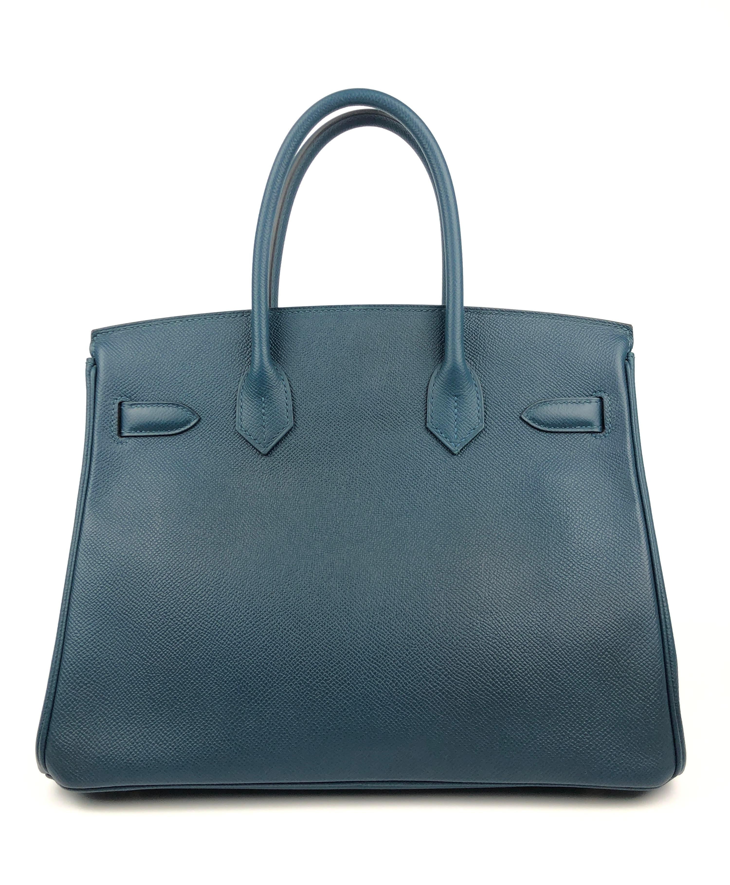 This authentic Hermès Deep Blue Epsom 30 cm Birkin is in pristine unworn condition; the protective plastic is still intact on the hardware.    Considered the ultimate luxury item, the Hermès Birkin is stitched by hand. Waitlists are commonplace and