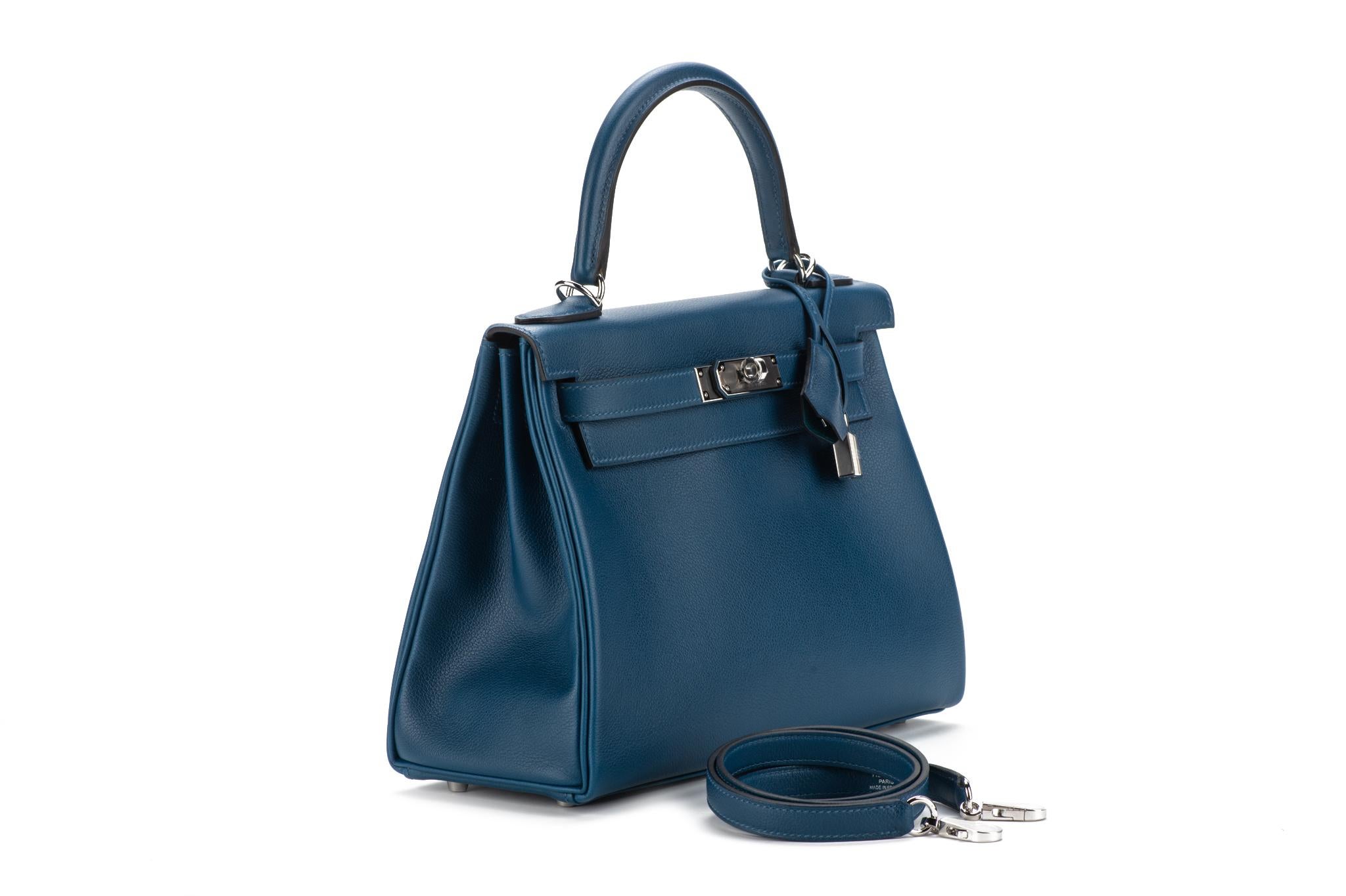 Hermes brand new in box kelly 28 retourne verso limited edition deep blue evercolor, vert bosphore goast skin interior with palladium hardware. Date stamp D for 2019. Comes with clochette, tirette, lock, keys, strap, dust cover, rain jacket, box,