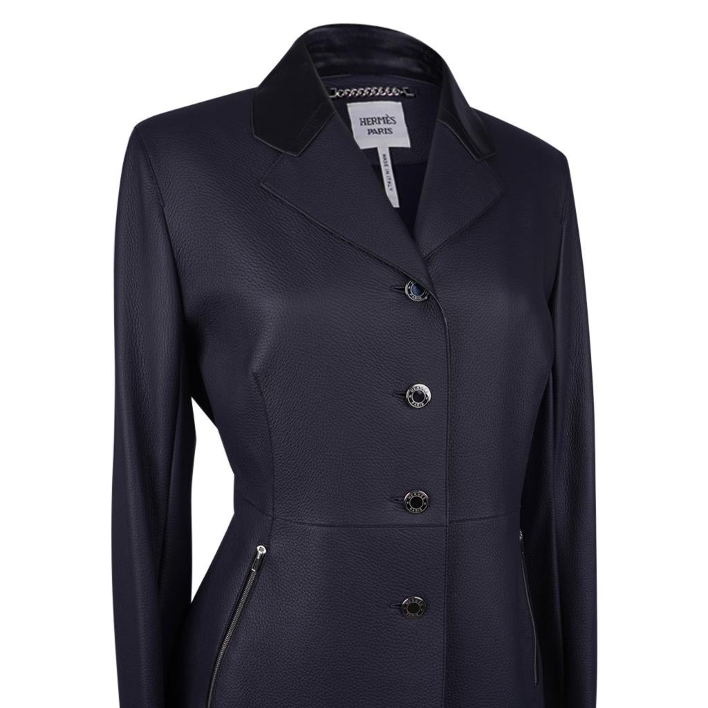 Mightychic offers a beautifully shaped Hermes Equestrian jacket featured in Marine Deerskin by Jean Paul Gaultier.
Four (4) mirror buttons with Hermes name.
Two (2) zip pockets with logo embossed pulls.
Rear has a design detail to accentuate the