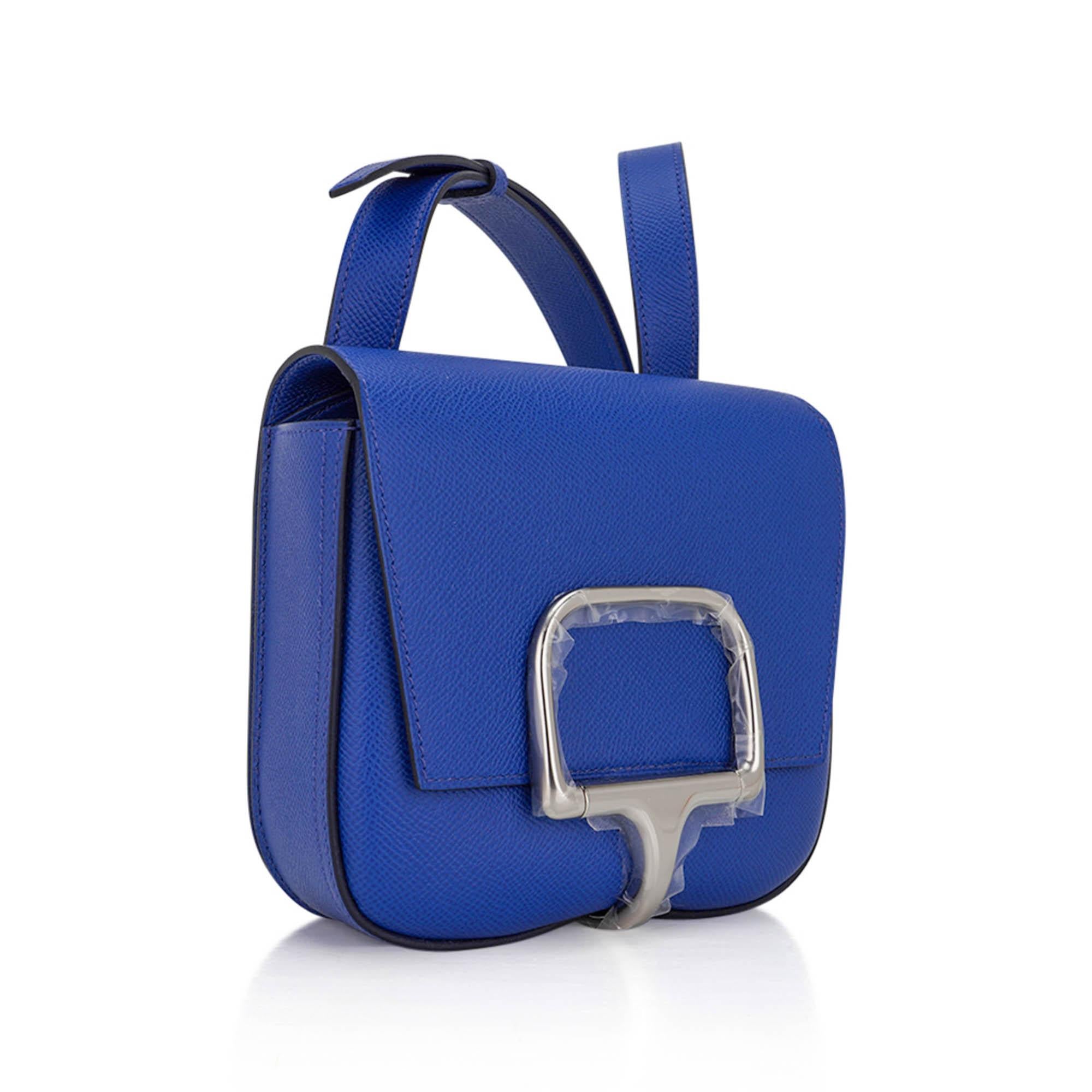 Hermes Della Cavalleria Mini bag featured in Electric Bleu.
Beautiful Palladium clasp inspired by the Verdun half-bit with the curved to compliment the shape of the bag.
The exquisite jewel tone is perfect for year round wear worn as a crossbody or