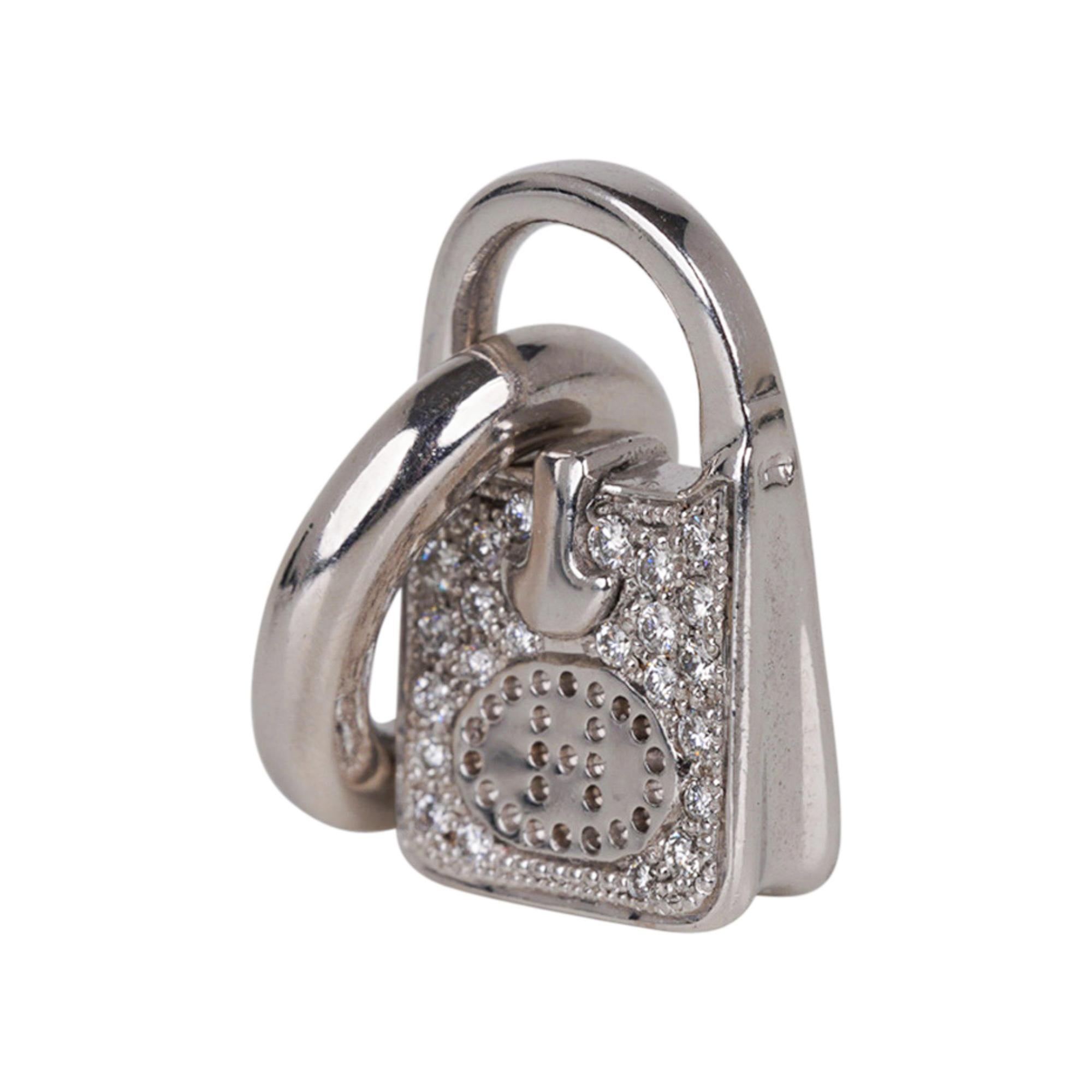 Mightychic offers an Hermes Diamond 18k White Gold Evelyne Bag amulette /charm.
This rare Hermes Evelyne charm piece can be worn as a pendant or on a bracelet.
Carefully crafted in exquisite detail including the perforated H!
Signature stamps on