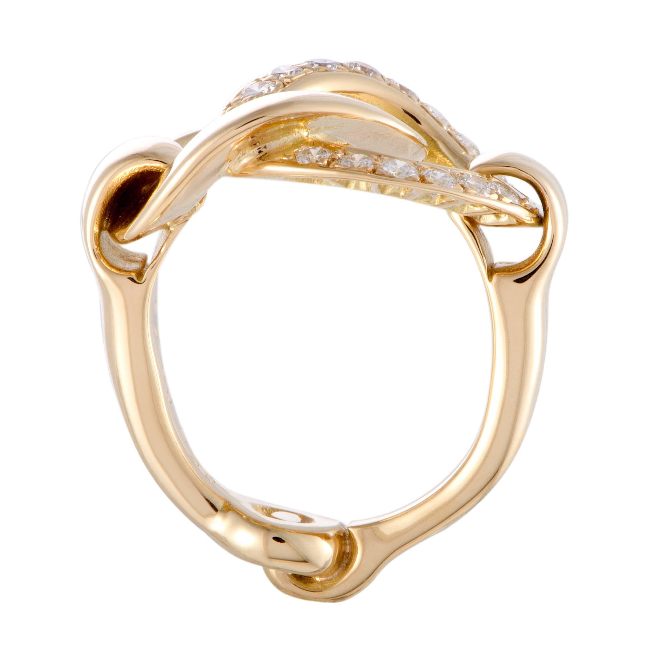 Bringing out the luxurious resplendence of diamonds in an exceptionally attractive manner, the alluring gleam of yellow gold gives a splendidly prestigious look to this fabulous ring. The ring is beautifully designed by Hermès, and it is expertly