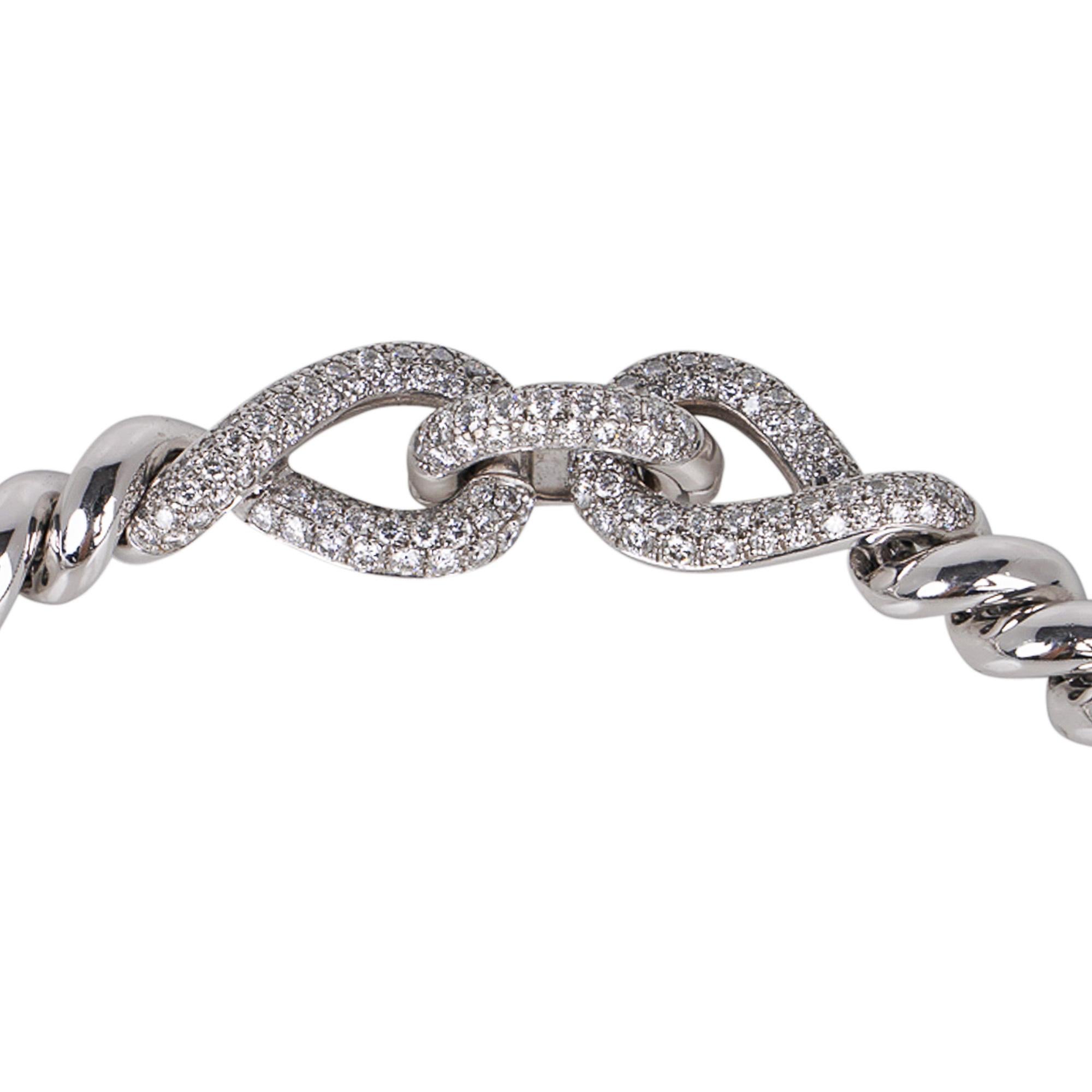 Mightychic offers a rare and highly collectible Hermes Torsade diamond necklace.
This Hermes choker style $65,000.00 necklace is featured in 18K high polish substantial white gold.
5.30 Carats of brilliant cut diamonds.
Closure is the fold over in