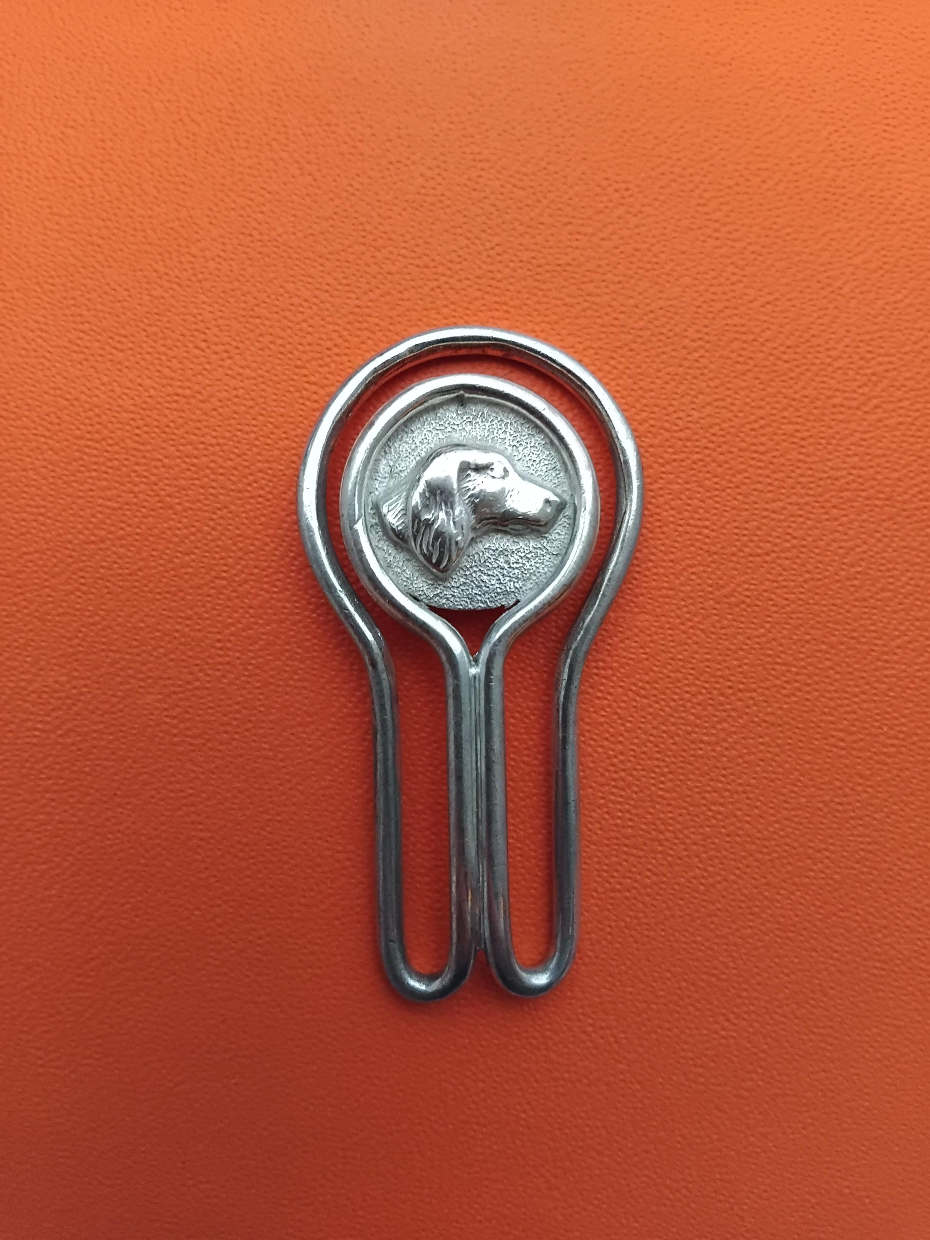 Rare and Lovely Authentic Hermès Clip

Rounded end decorated with a dog's head in profile

Can be used as money clip or paper clip, bookmark 

Vintage Item

Made of silver (crab hallmark)

Colorway: silvery

