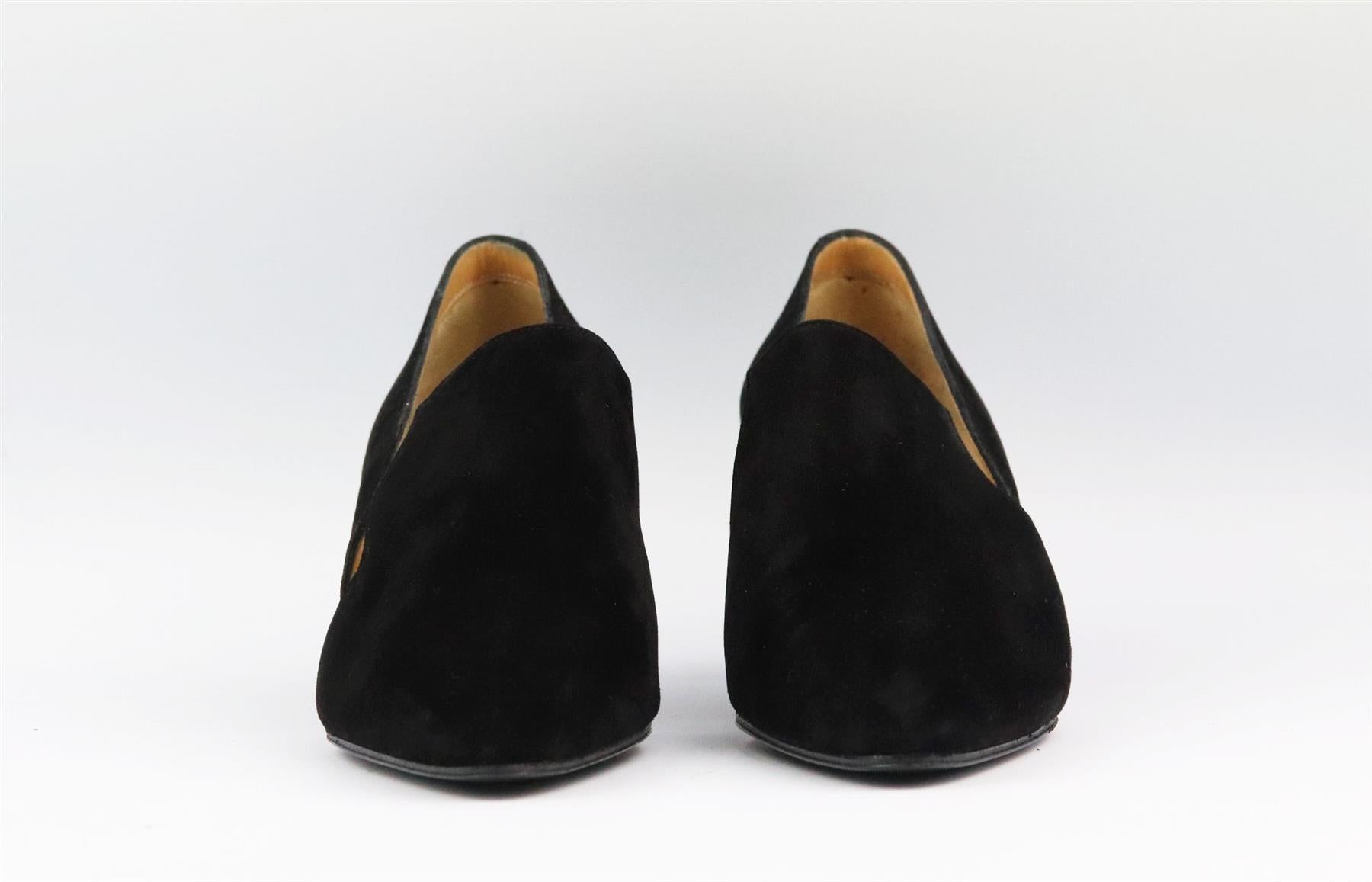 These pumps by Hermès have been crafted in Italy from black suede, this bold point-toe pair has a flattering d'Orsay silhouette and a subtle high heel to take you from morning meetings to dinner with friends. Heel measures approximately 57 mm/ 2