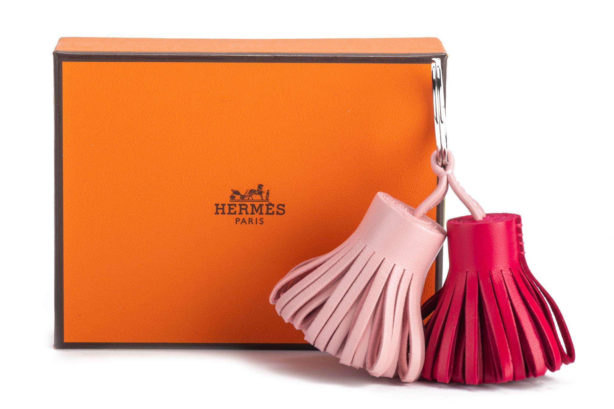 Hermes fuchsia and pink leather double Carmen tassel keychain. Palladium metal Brand new with original box and ribbon