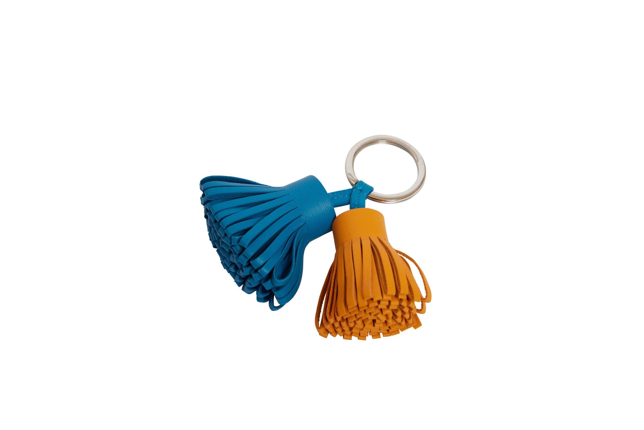 HERMES curry and blue leather double Carmen tassel keychain. Palladium metal Brand new with original box, ribbon, and shopping bag.