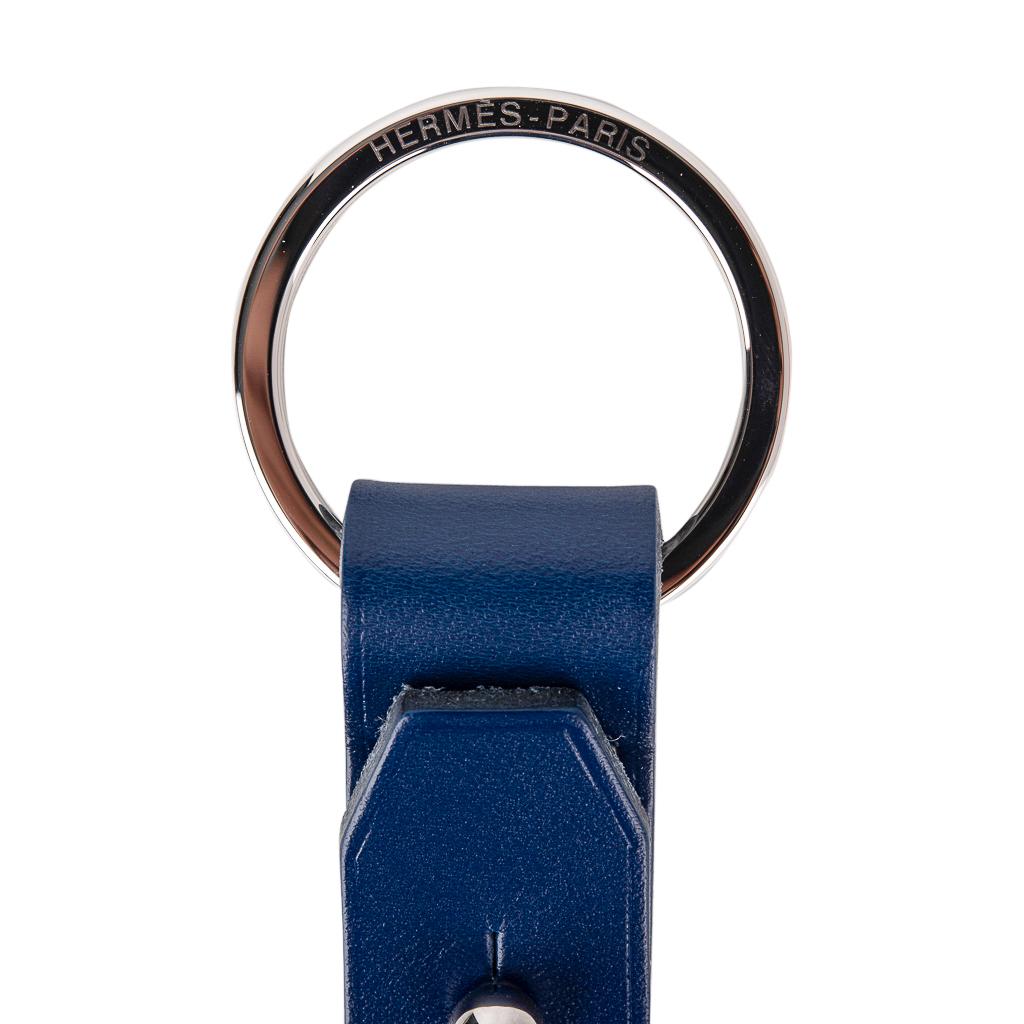 Guaranteed authentic Hermes Double Jeu Voiturier valet Key Ring in Bleu Saphir ( Blue Sapphire) Vache Hunter leather.
Can be opened to separate key rings.
Hermes Paris embossed on both rings.
Comes with signature Hermes box. 
New or Store Fresh