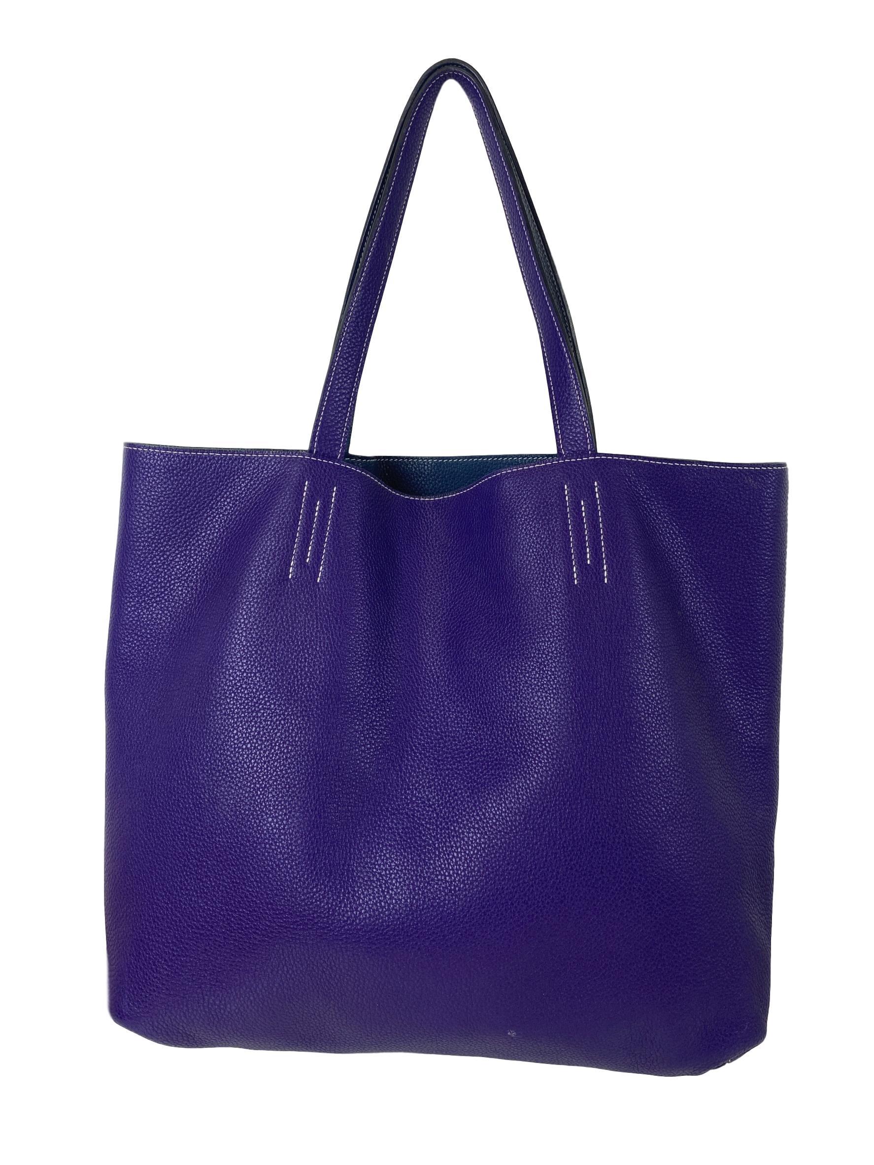 Hermès Double Sens Tote Clemence 45 from Fall 2014. This Double Sens bag is reversible in the beautiful coloration of Iris/Blue de Malte and Hermès stamp in gold foil. The perfect day to night bag, this classic Hermès style pairs with any occasion.