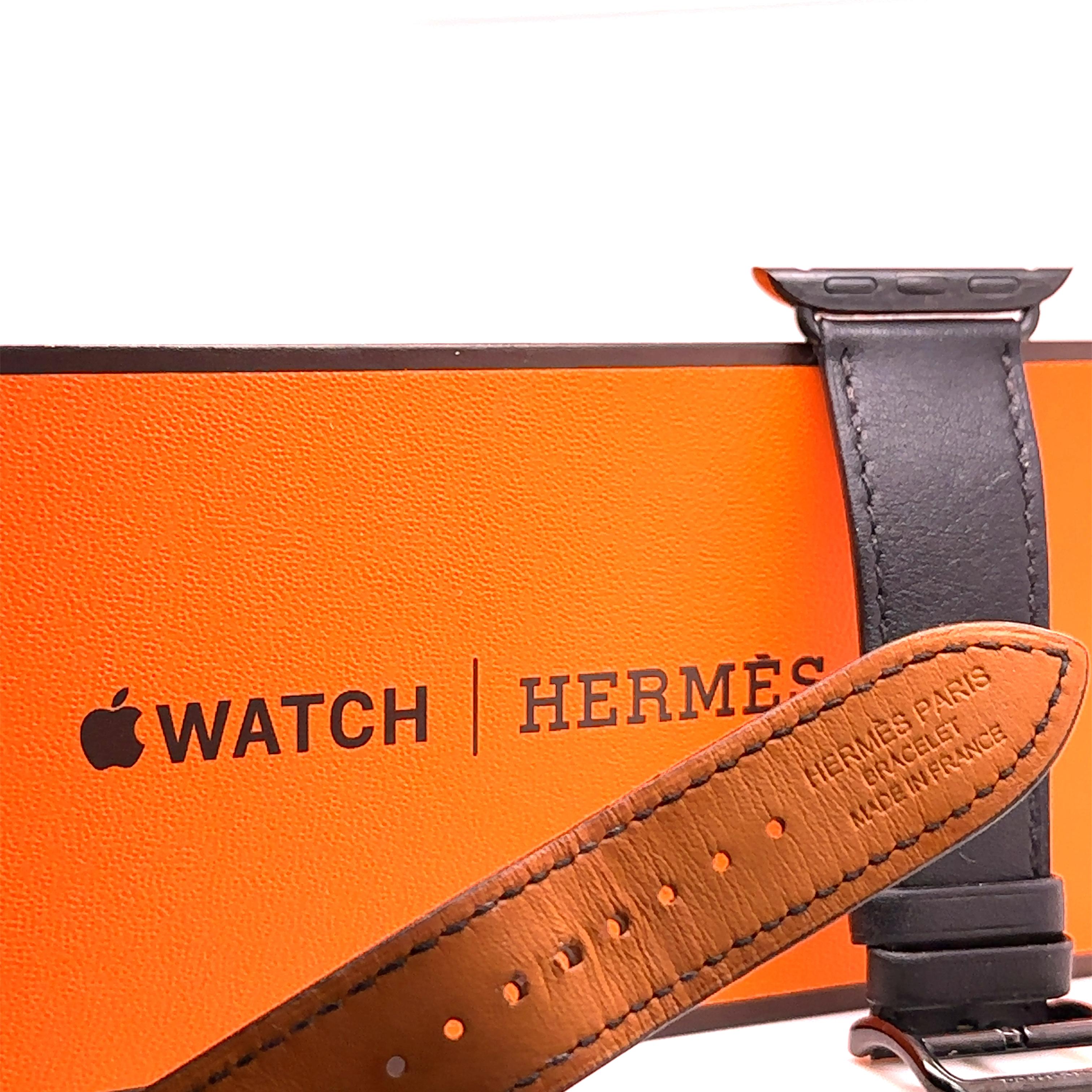 A Hermès Double Tour 41mm Attelage Apple Watch Band in Black Leather. Wrist size from 130mm to 155mm.

Note - You can match this band with any stainless steel Apple Watch case (Series 9 or previous versions). The 41 mm band works with the 38 mm, 40