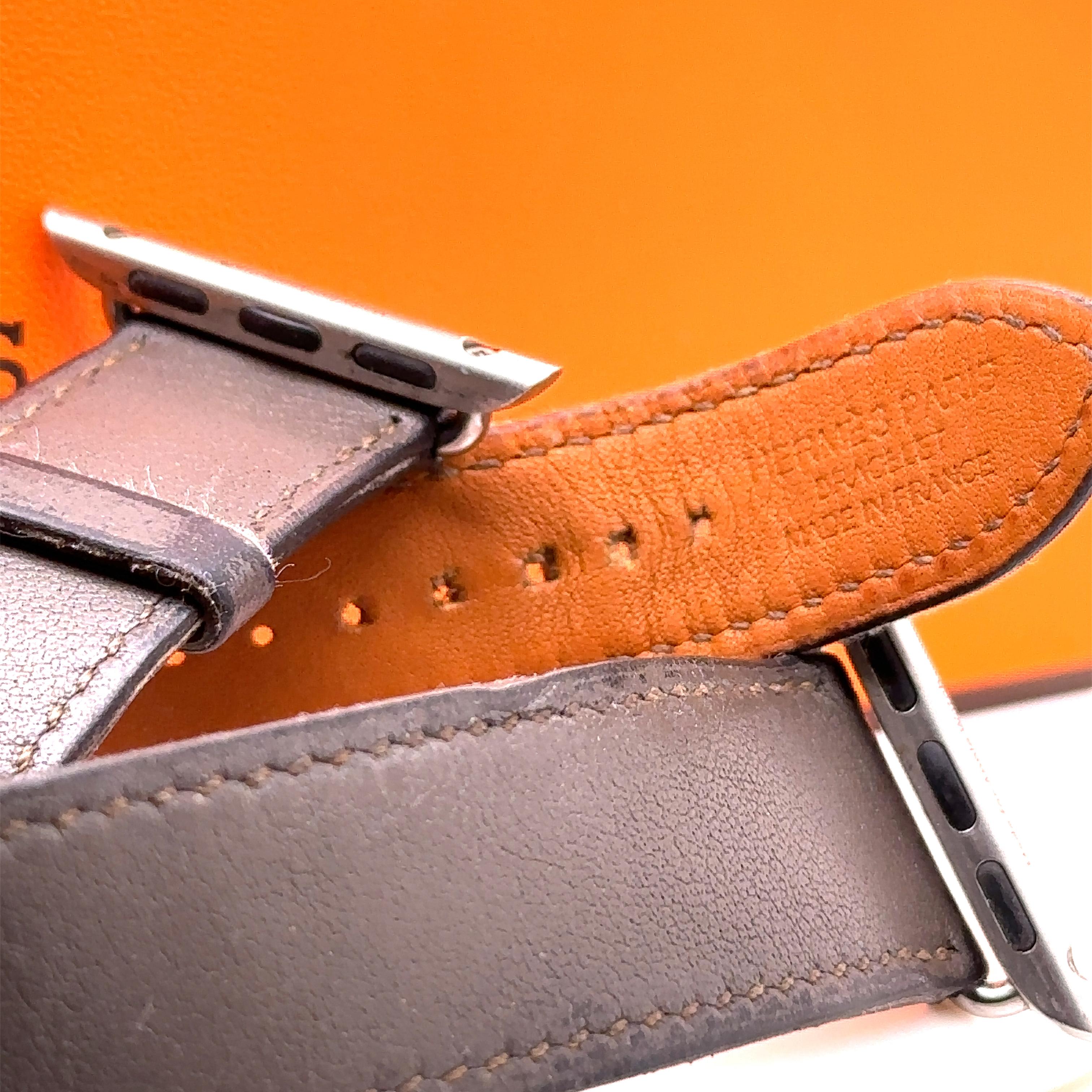 A Hermès Double Tour 41mm Attelage Apple Watch Band in Brown Leather. Wrist size from 130mm to 155mm.

Note - You can match this band with any stainless steel Apple Watch case (Series 9 or previous versions). The 41 mm band works with the 38 mm, 40