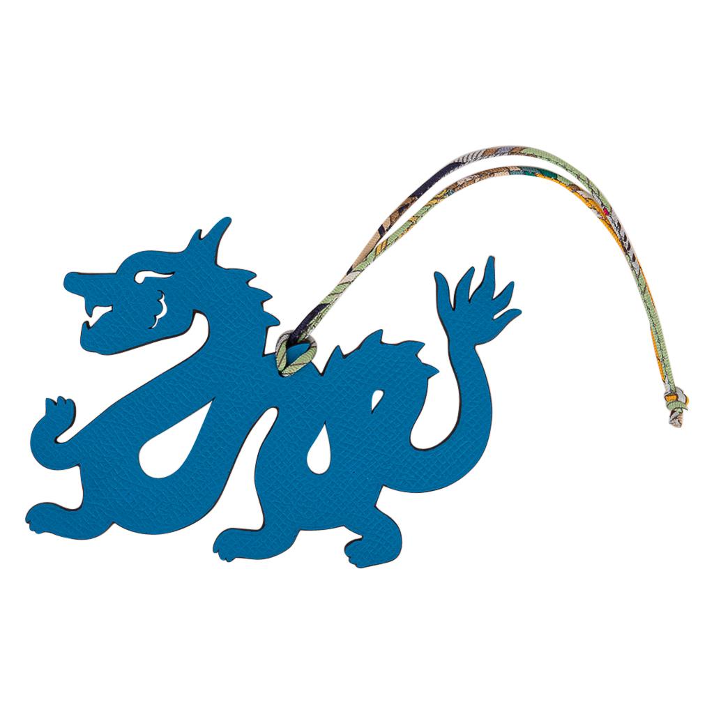 Guaranteed authentic very rare limited edition Hermes Petit h bi-color Dragon bag charm with silk twill cord.
This was a special limited edition for the petit H exhibit in Seoul.
This whimsical charm comes in Cuivre Togo and Blue Epsom and can be