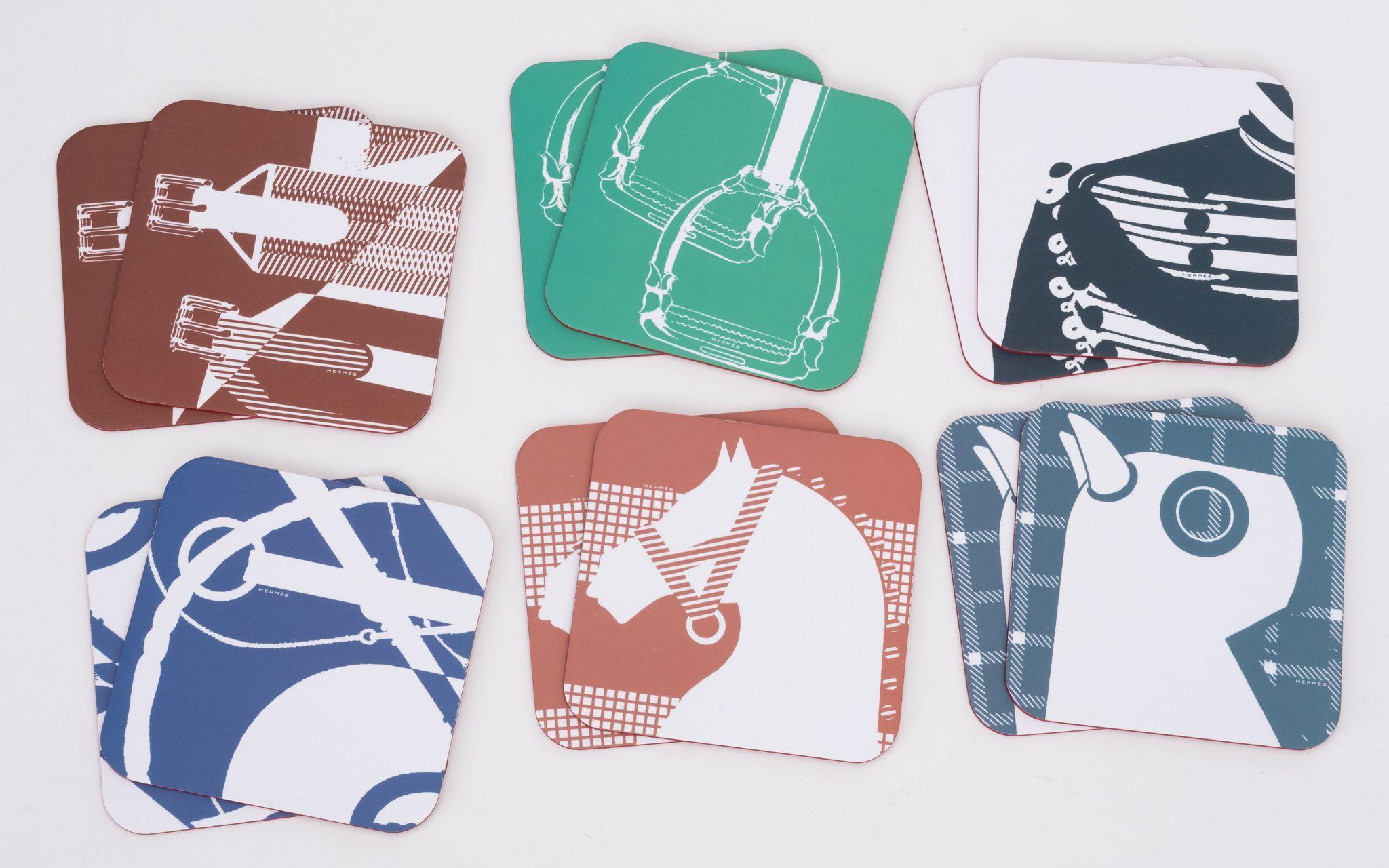 Hermès brand new set of 12 coasters, horse subjects in different colors. Comes with original box and ribbon.
