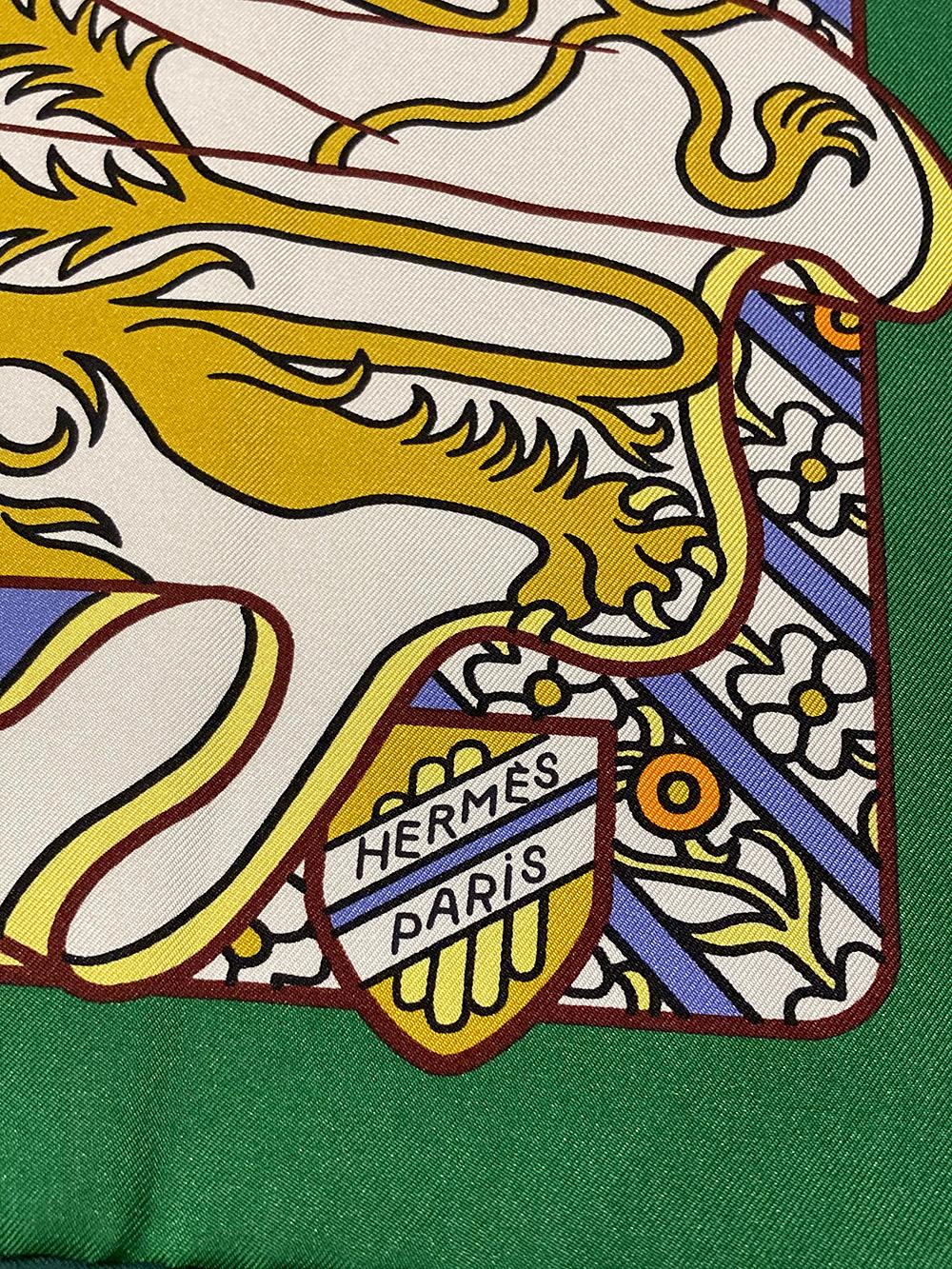 Hermes Duels Oniriques Silk Scarf in excellent like-new condition. Original silk screen design c2019 by Pierre Marie features colorful ornately decorated knights and steeds in dreamy regalia of blues, yellows, gold, orange and white over a green