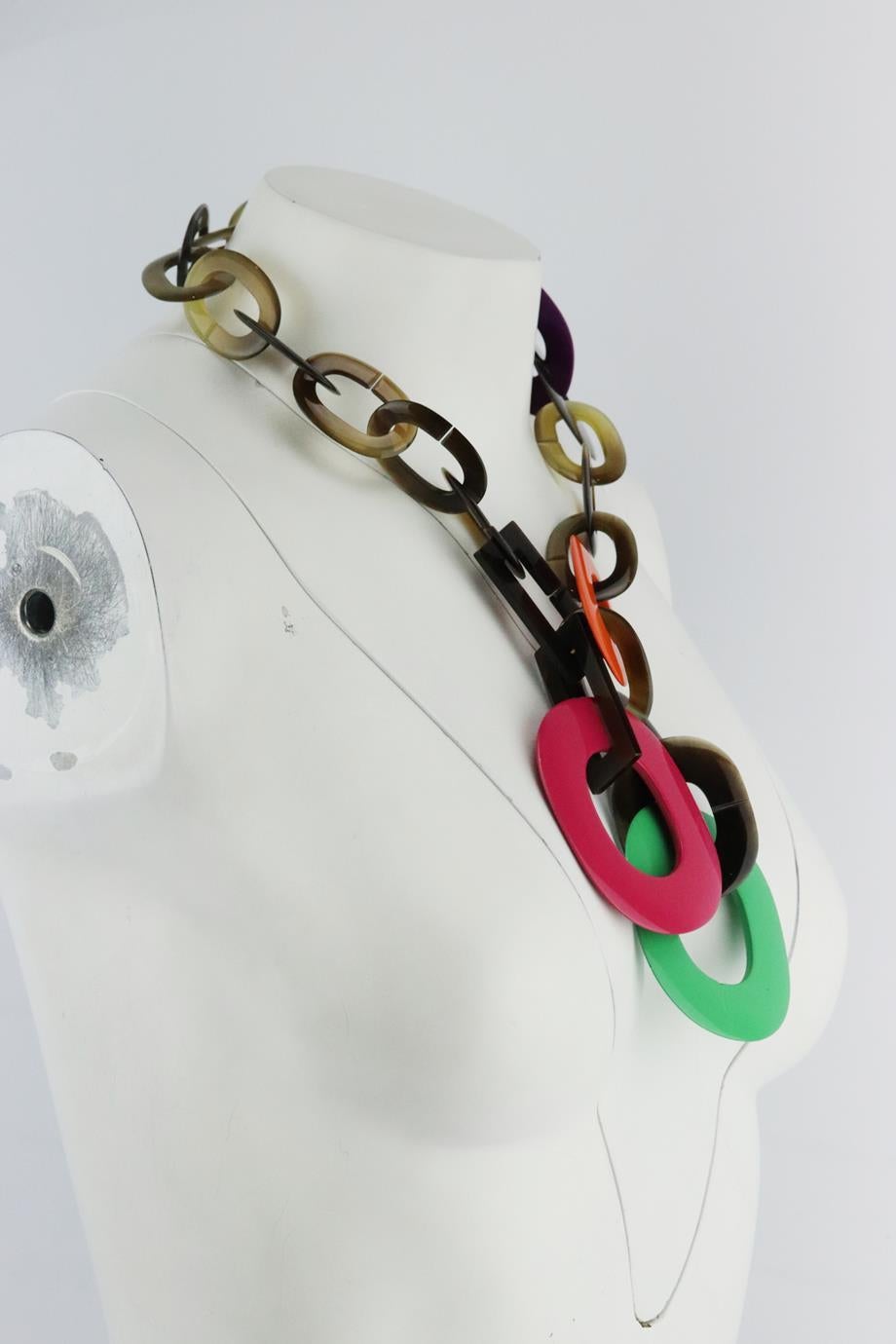 Hermès Duncan horn and lacquer lariat necklace. Made from horn and lacquer interlocking chain in differing shapes and sizes. Tonal-brown, purple, orange, green and pink. Slips on. Does not come with dustbag or box. Drop: 9.5 in. Pendant Drop: 5 in.