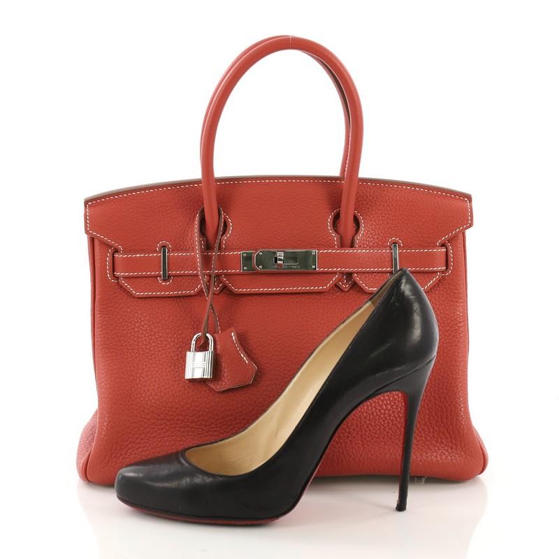 This Hermes Eclat Birkin Handbag Clemence with Palladium Hardware 30, crafted in Sanguine red Clemence leather, features dual rolled handles, front flap, and palladium hardware. Its turn-lock closure opens to a Blanc white Chevre leather interior