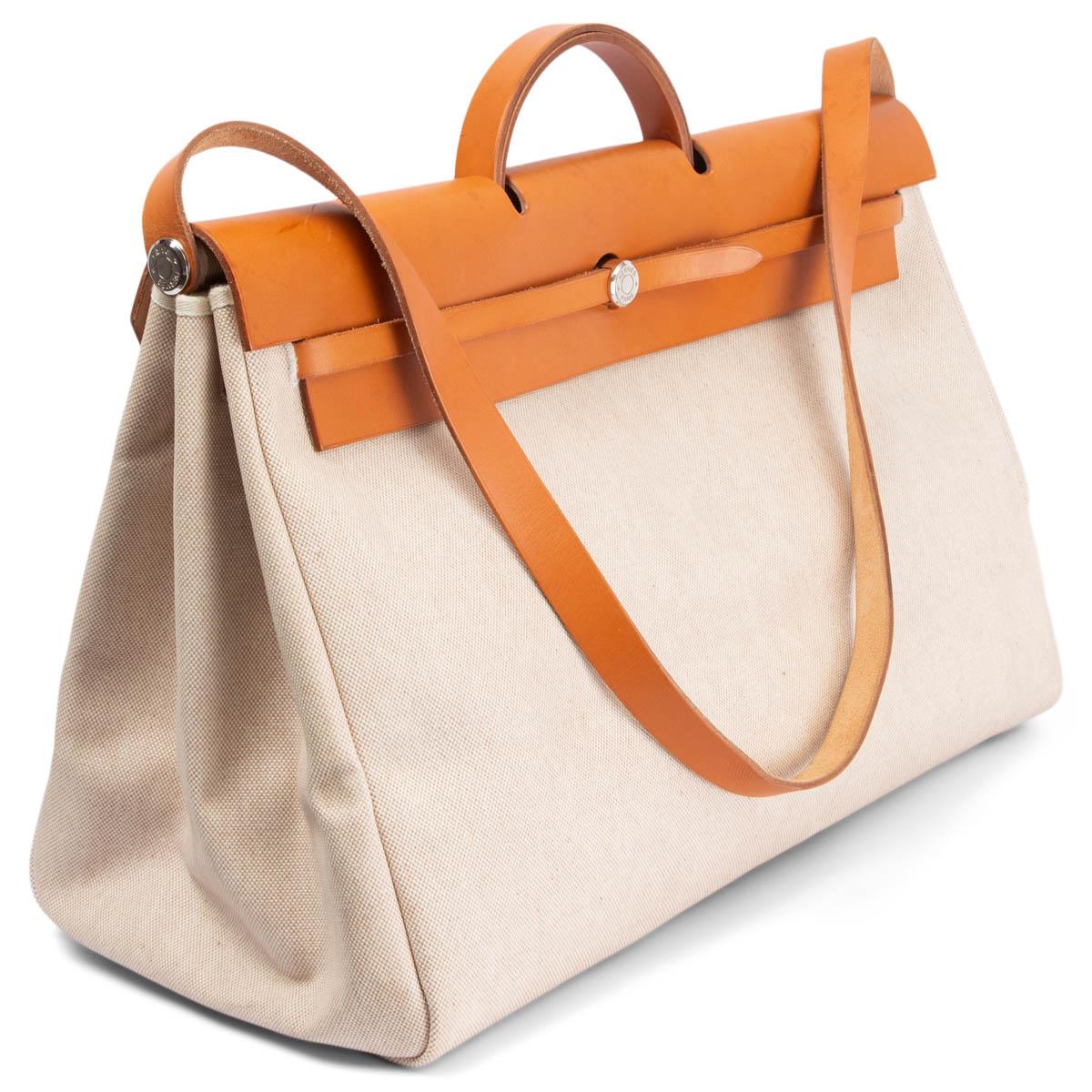 100% authentic Hermès Herbag 50 travel bag in off-white coated Toile H canvas with natural Vache Bride leather. Comes with an additional body, same width but 42cm height. Has been carried with faint wear to the corners, soft scratches and a few very
