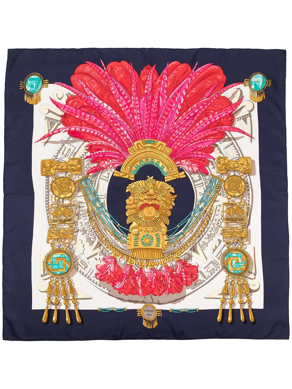Crafted in France from the finest silk, this pre-owned scarf by Hermès features lightweight construction, a square shape, and a myriad of Egyptian feathers, designed in the 1980s. This versatile piece would look great with any outfit but can also be