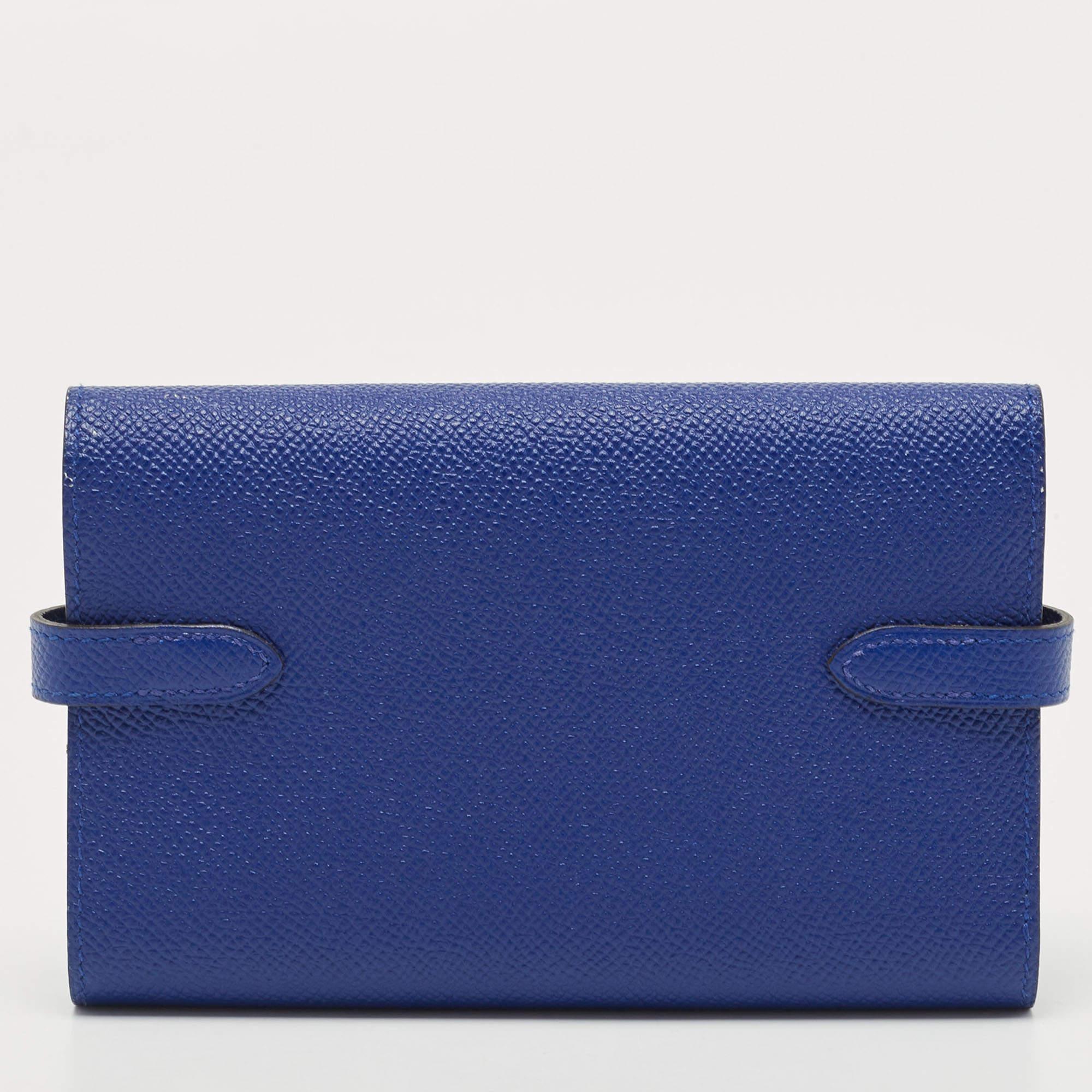 The Hermès Kelly Depliant wallet is a sophisticated and luxurious accessory. Crafted from exquisite Epsom leather in a striking electric blue hue, this wallet exudes elegance. Its Kelly-inspired design showcases a fold-over flap and a sleek, compact