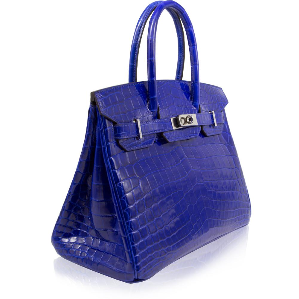 This Hermès Birkin is a truly spectacular, one-of-a-kind item and a must have for any serious collector. Crafted in a deeply vivid and shocking Electric Blue Nilotius Crocodile Leather and accented by glossy, silver-plated palladium hardware. A
