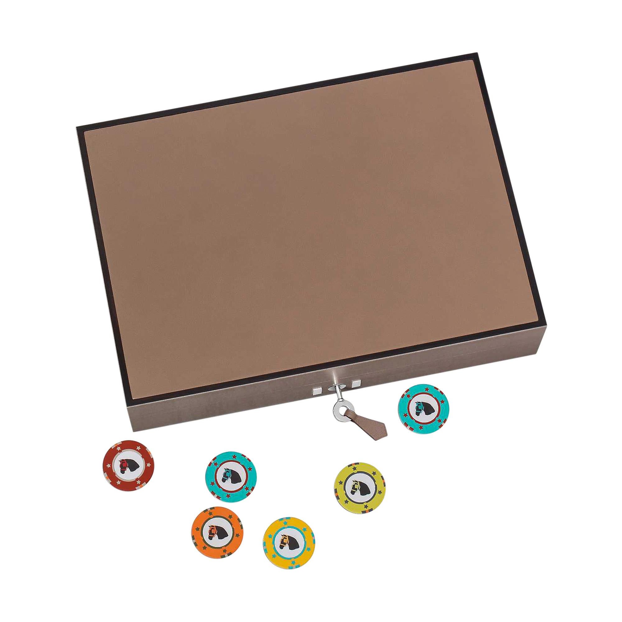 Mightychic offers a guaranteed authentic Hermes Elements Poker box for entertainment with a dash of luxury.
Crafted in matte grey sycamore with a cedar wood interior.
Calfskin leather top and tab for key.
The set includes 300 multi coloured poker