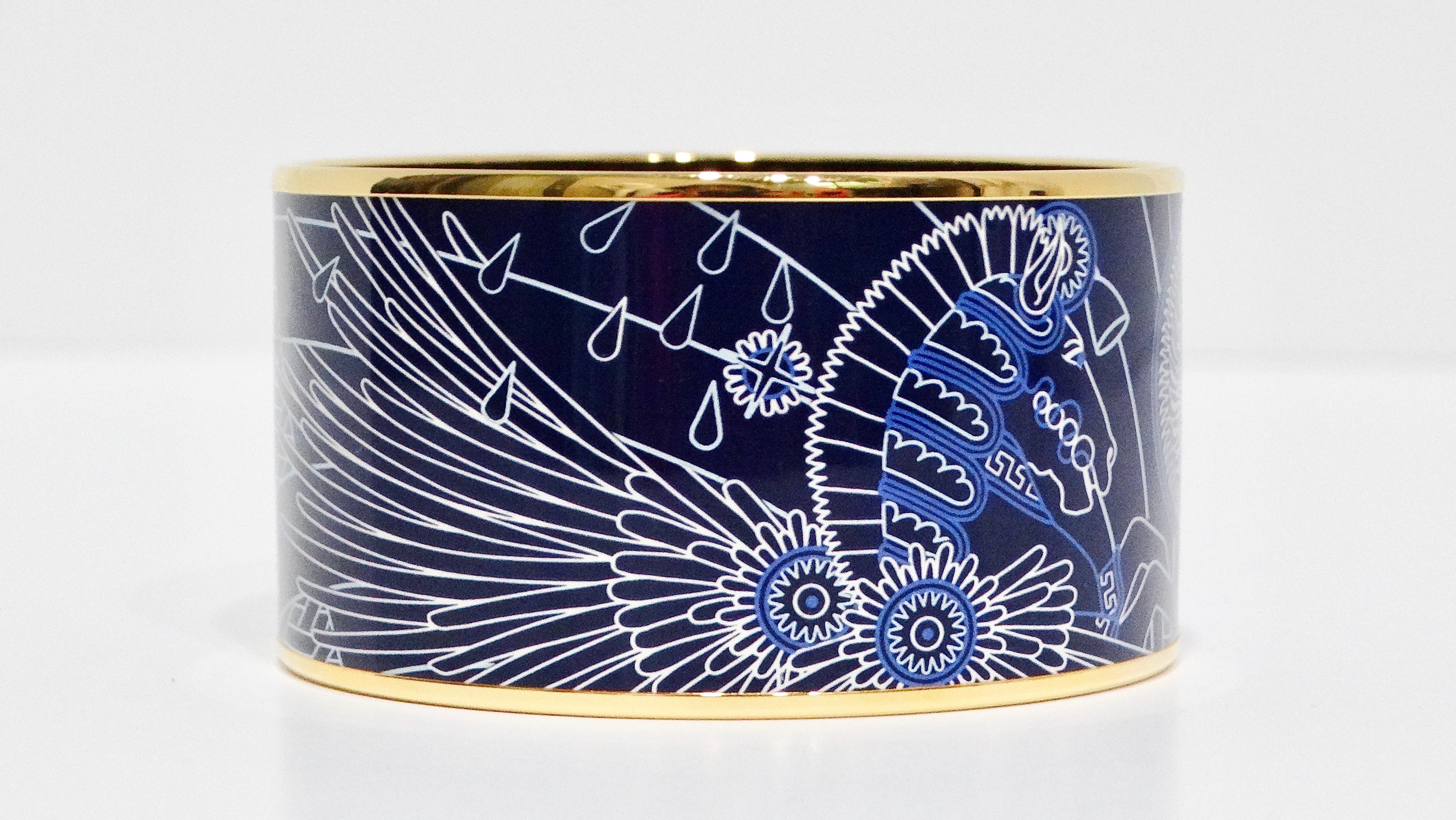 The Hermès enamel 18k gold-plated blue Pegasus motif cuff bracelet is a stunning example of luxury and artistry, crafted in France. The bracelet features a vibrant blue enamel inlay adorned with a captivating Pegasus motif, symbolizing elegance and