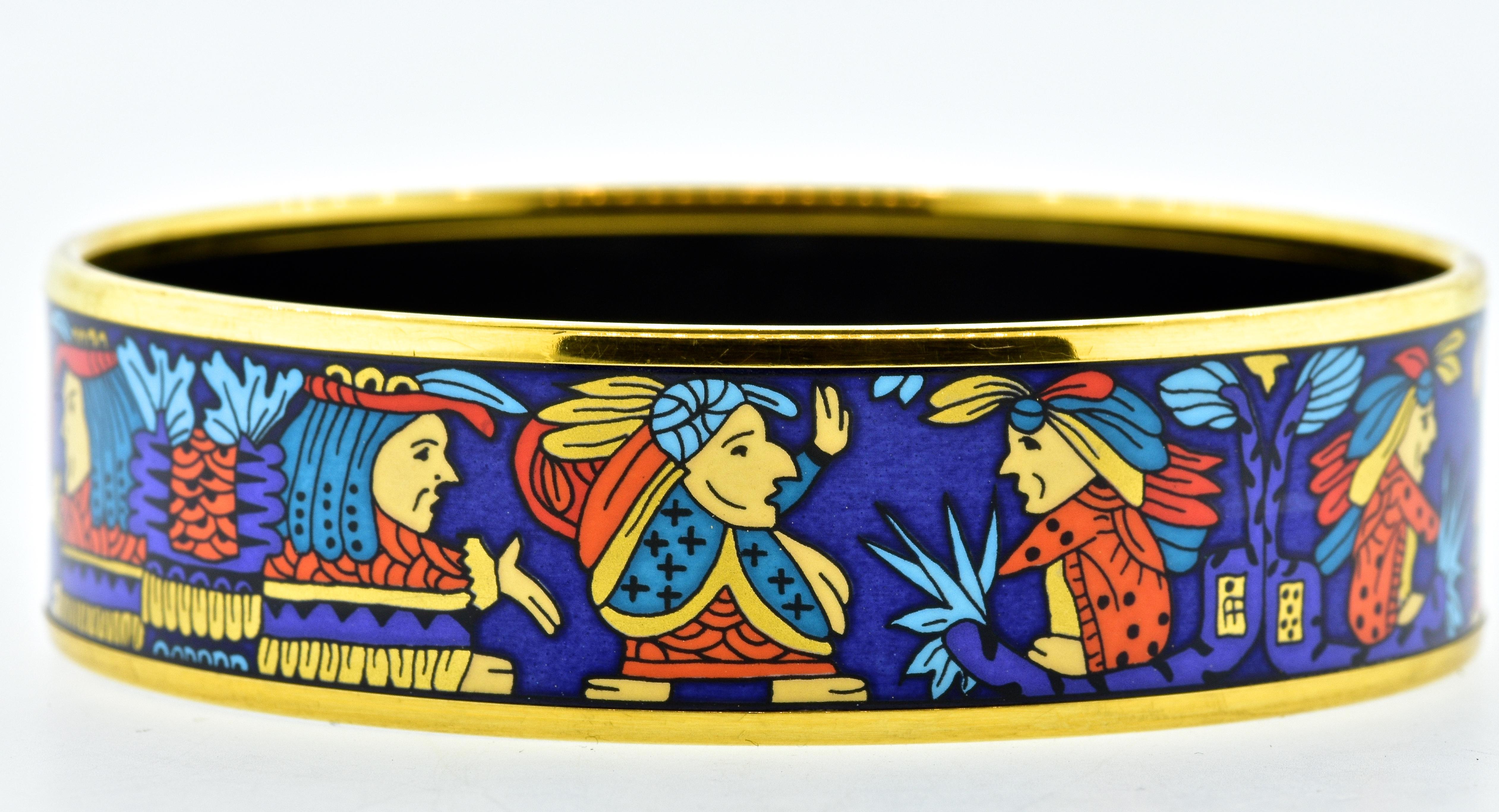 Hermes Paris enamel bangle bracelet, size large.  Multi color enamel, this wide statement is .75 inches wide and had an interior diameter of 2.75 inches which is medium to wide wrist.  This vintage Hermes Paris piece is in excellent condition.  It