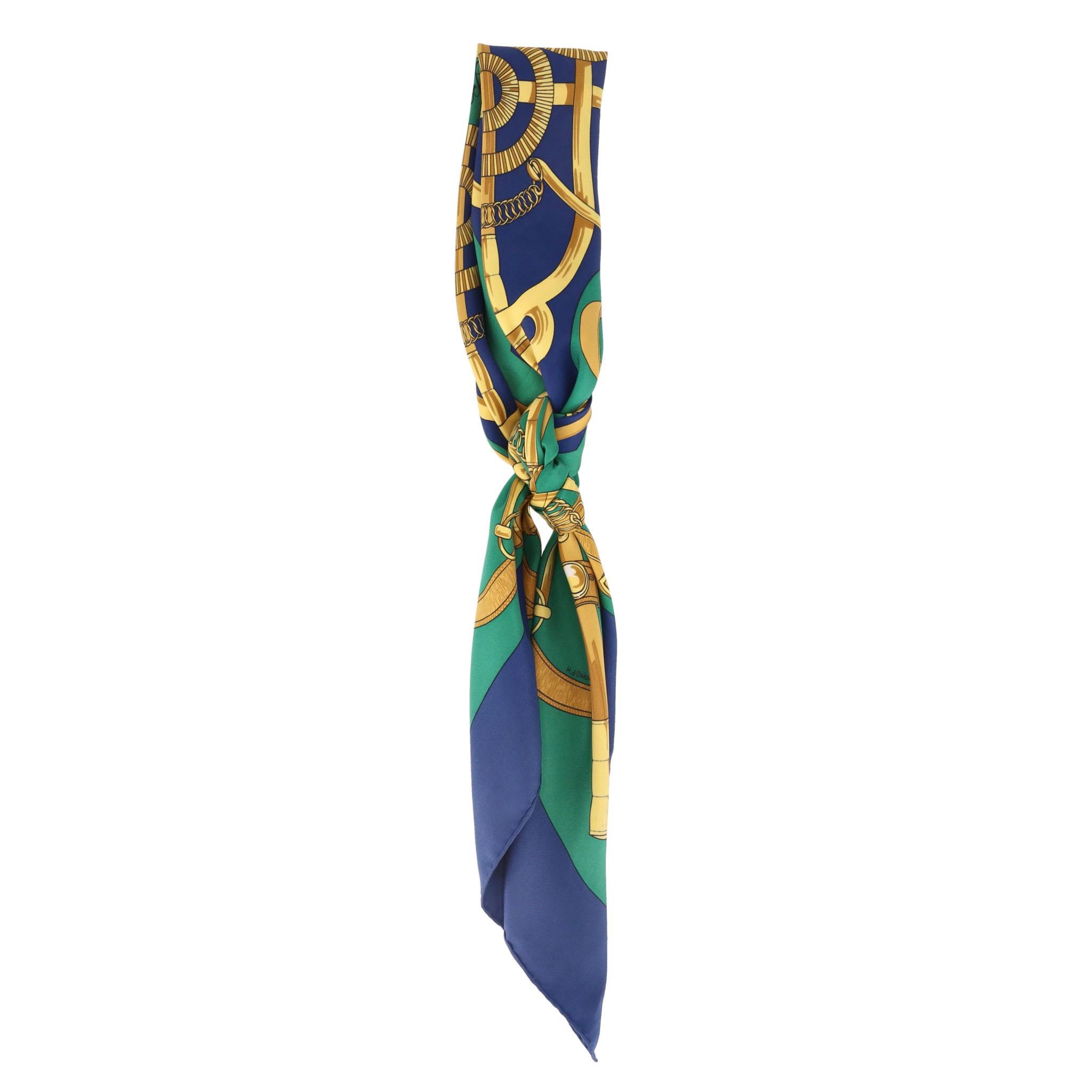 Hermes Eperon D'Or Silk Twill Scarf

Square green scarf crafted from silk with signature Eperon D'Or design in gold with blue centre and borders.

Featuring hand-rolled edges and 'Hermes Paris' signature in black.

Rrp Approx. £450

Size – 90 x