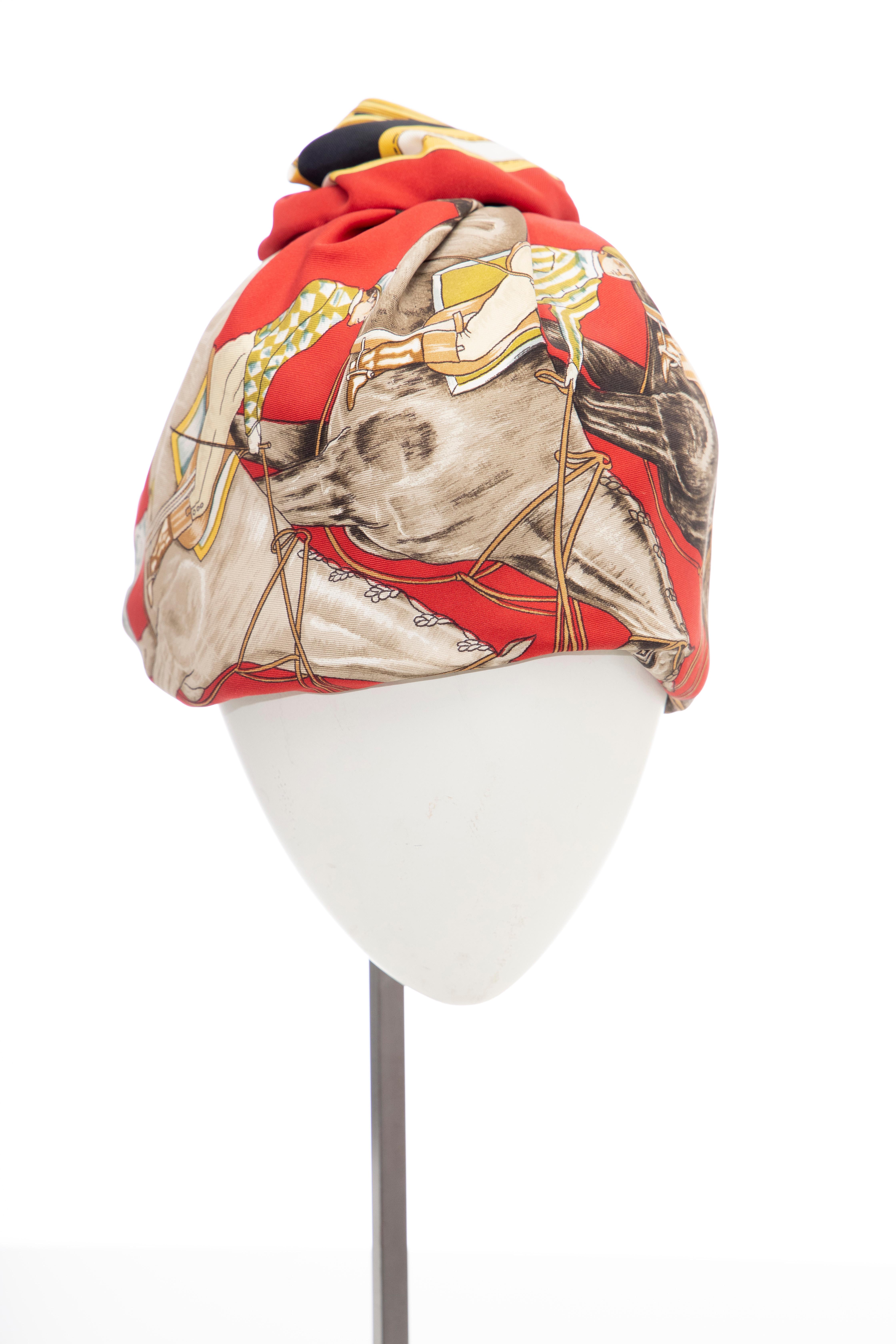 Hermes, Circa: 1970's equestrian printed silk turban with netted interior and grosgrain headband.

Circumference: 23 inches