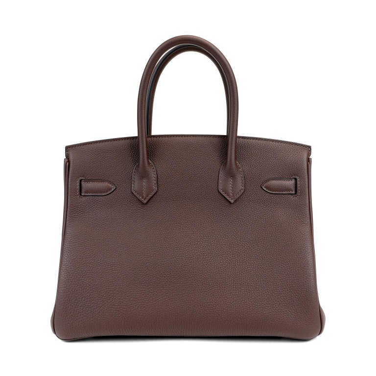 This authentic Hermès Espresso Brown Togo 30 cm Birkin is in pristine condition.    Hand stitched by skilled craftsmen, wait lists of a year or more are common for the Hermès Birkin. They are considered the ultimate in luxury fashion. Neutral