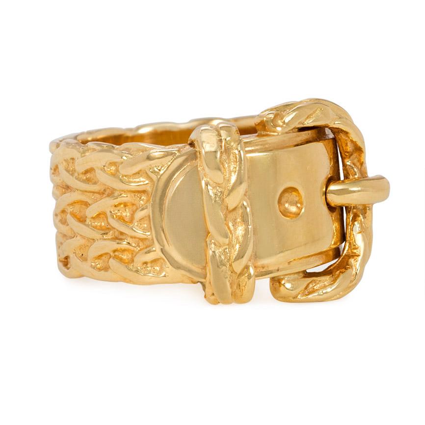 A gold band ring designed as a braided buckled belt, in 18k. Hermès, Paris, #25161

Approximately 9/16