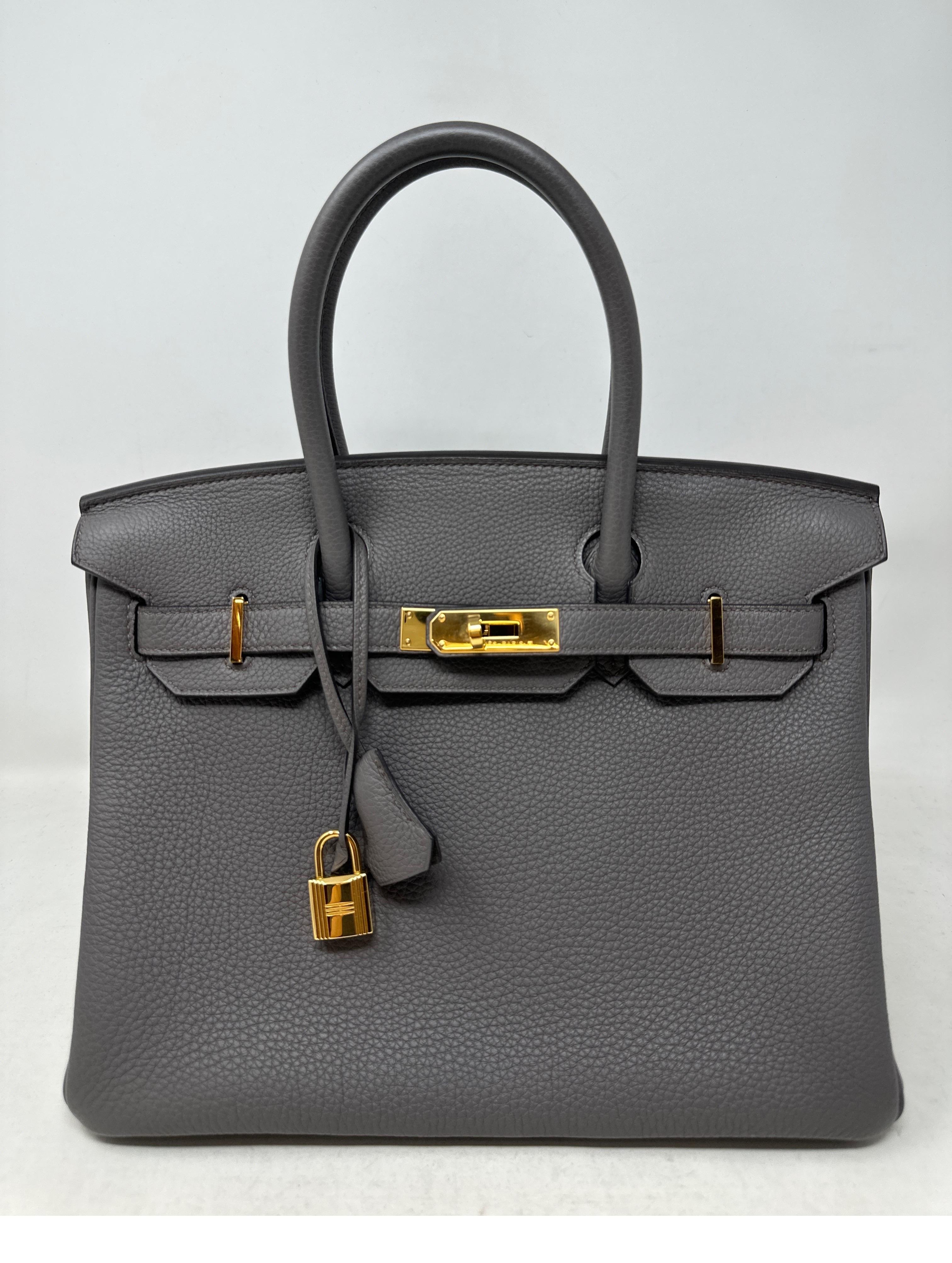 Hermes Etain Birkin 30 Bag. Newer Hermes Birkin. Gold hardware. Plastic still on hardware. The most wanted size and color of the season. Great investment bag. Includes clochette, lock, keys, and dust bag. Guaranteed authentic. 