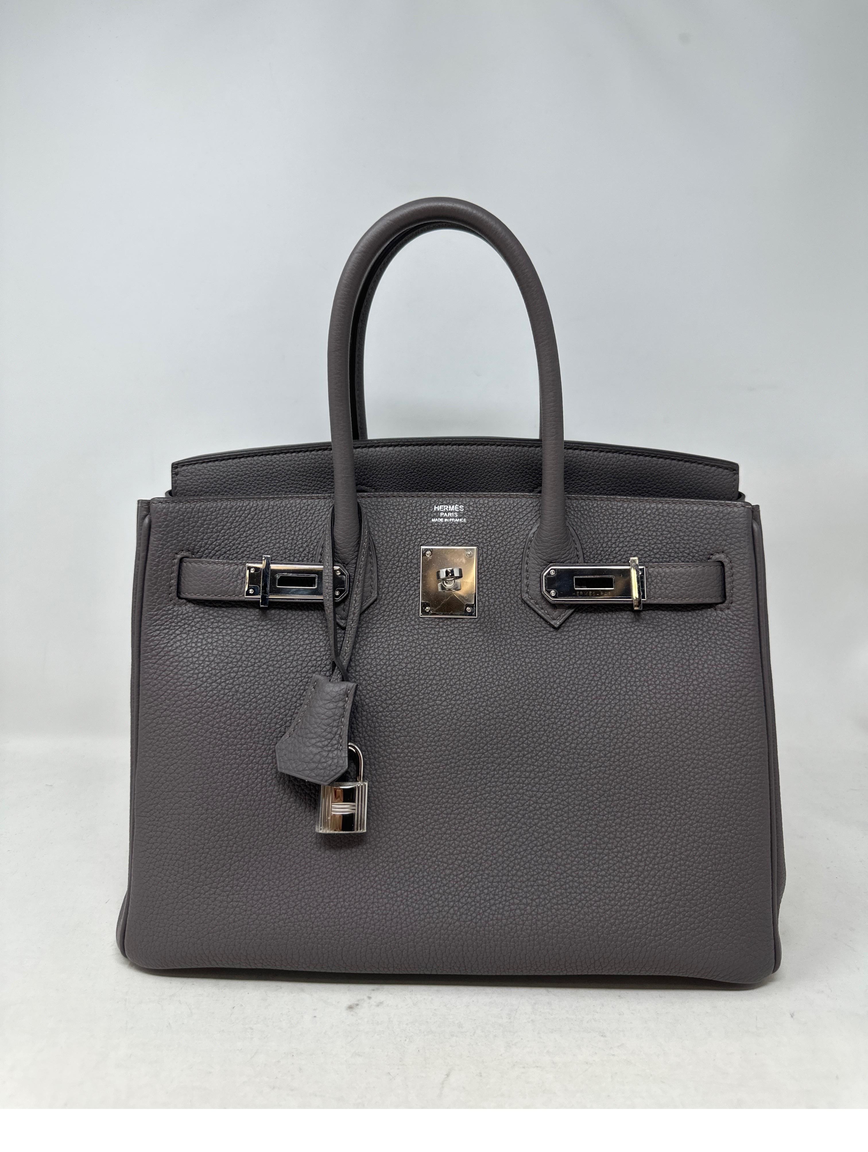 Hermes Etain Birkin 30 Bag. Palladium hardware. Excellent condition like new. Newer bag. Plastic is on the hardware. Most wanted neutral color. Don't miss out on this one. Includes clochette, lock, keys, and dust bag. Includes original receipt.