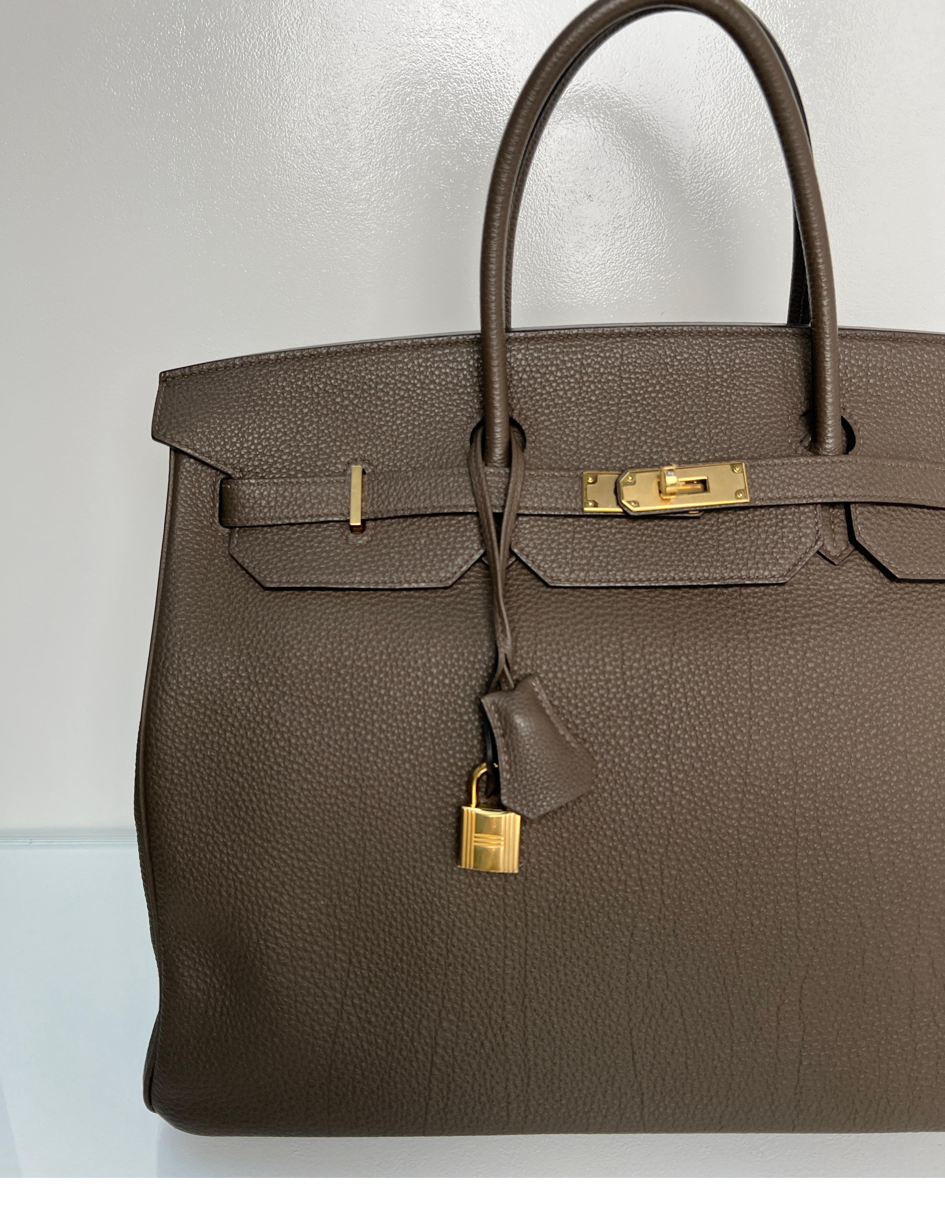 Hermes Etain Birkin 40 Bag. Gorgeous color. Neutral grey tan color. Hard to find size 40 Birkin. Gold hardware. Interior clean. Excellent condition. Includes clochette, lock, keys, and dust bag. Guaranteed authentic. 